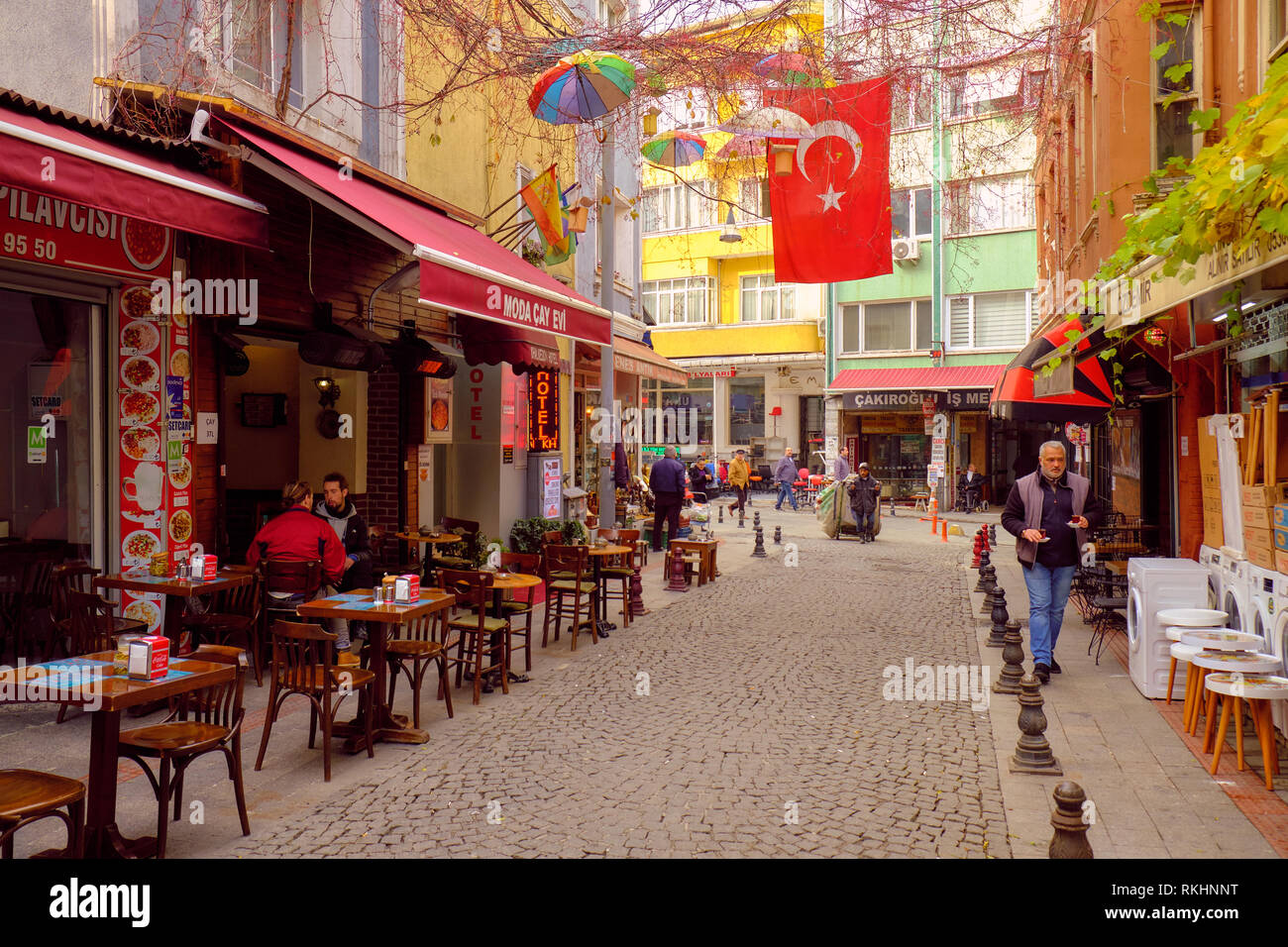 Local life on a Pedestrian street lined with business in the core of Kadikoy, on the asian side of Istanbul, Turkey - December Stock Photo