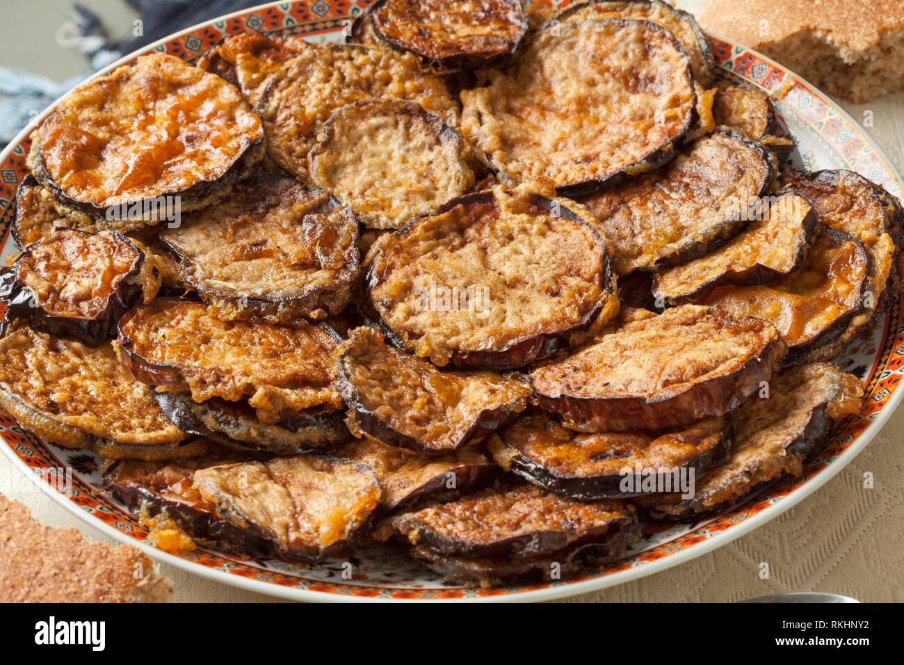 Colorful dish with baked eggplant close up. Stock Photo