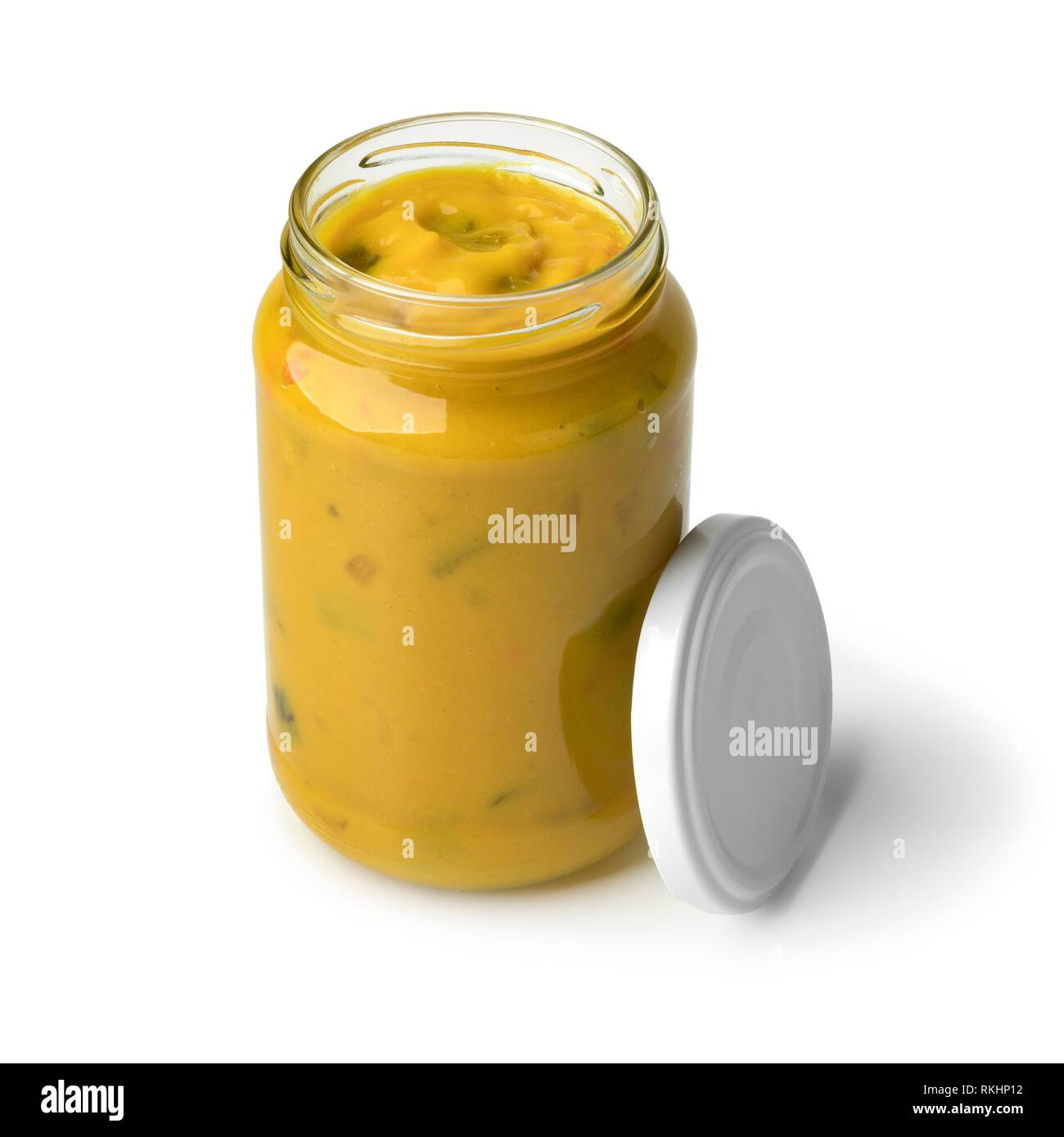 Jar of fresh yellow homemade piccalilli isolated on white background. Stock Photo