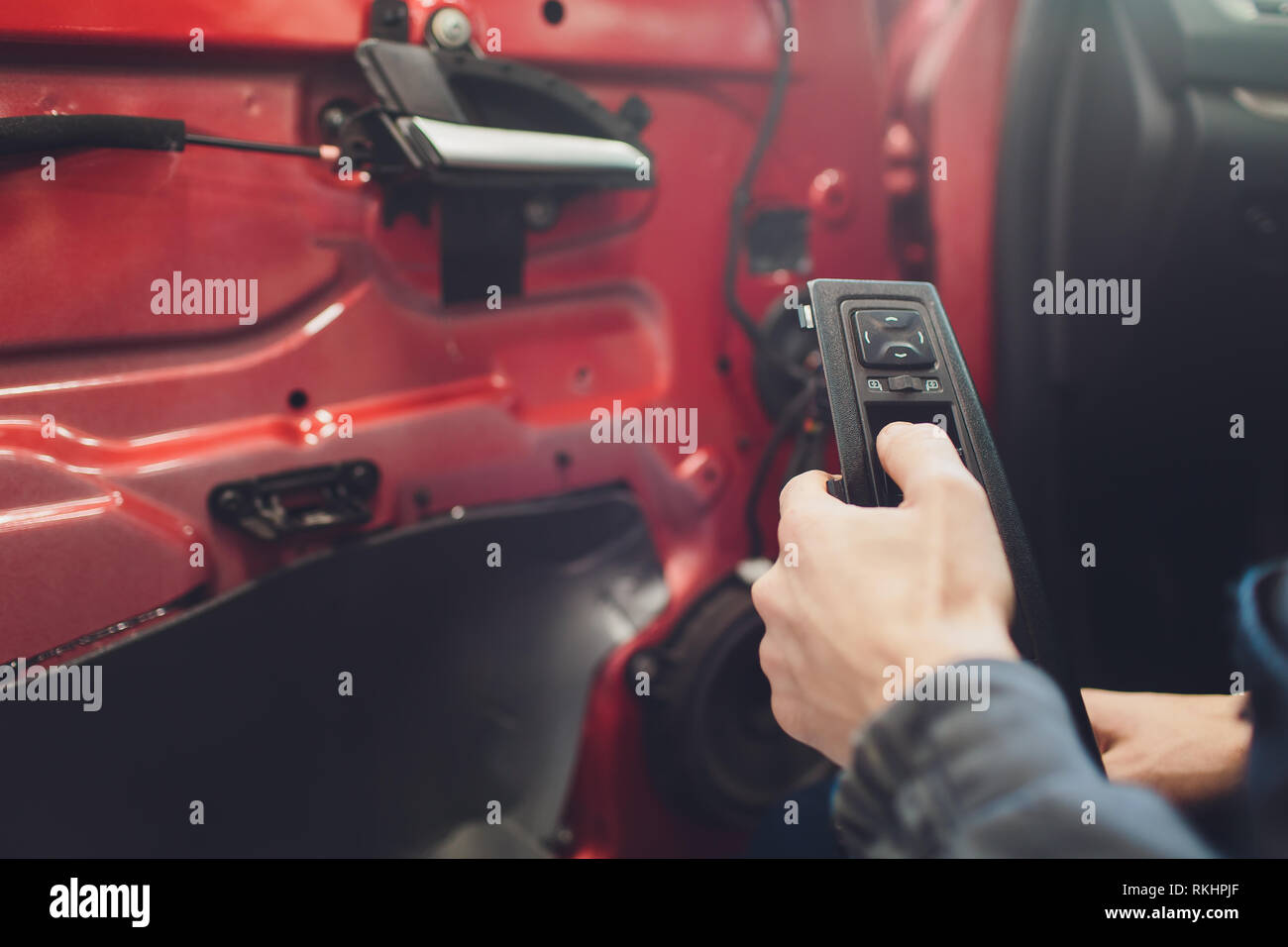 Mechanic installing car central door lock motor Stock Photo Alamy
