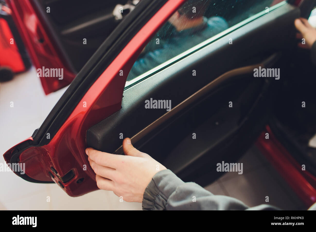 Mechanic installing car central door lock motor Stock Photo Alamy