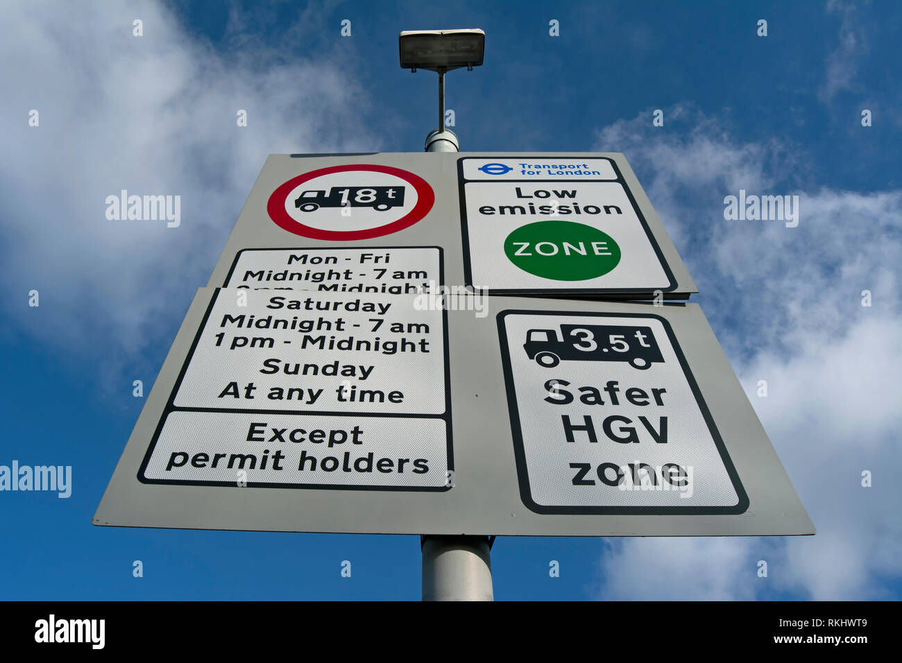 road sign in kingston, surrey, england, denoting a low emissions zone, a safer hgv zone, weight limits and parking restrictions Stock Photo