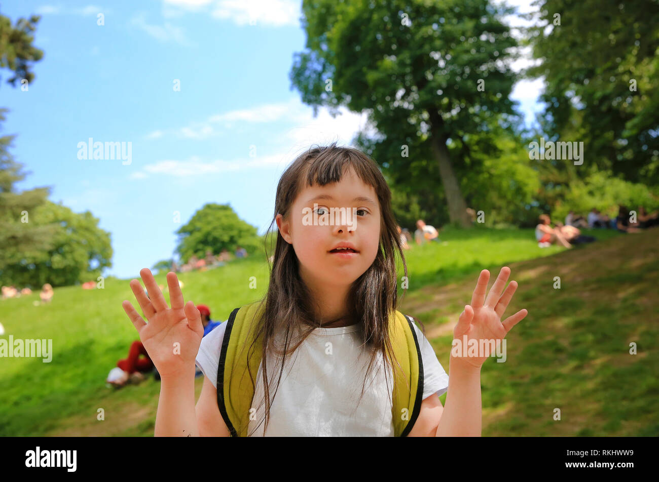 Portrait of little girl smiling outside Stock Photo - Alamy