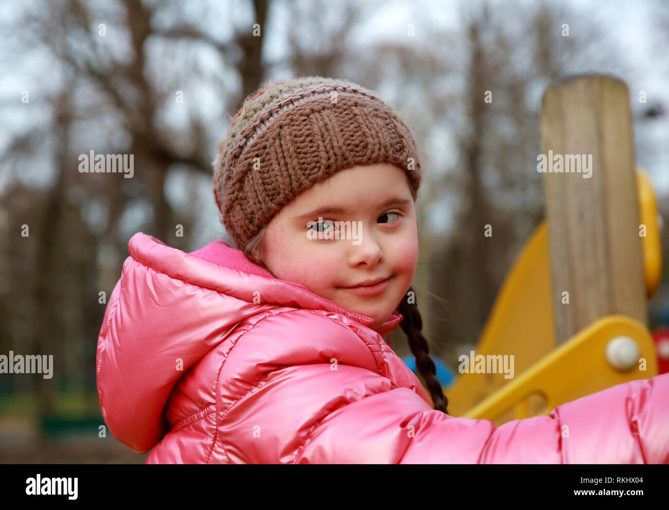 Portrait of beautiful girl on the playground Stock Photo - Alamy