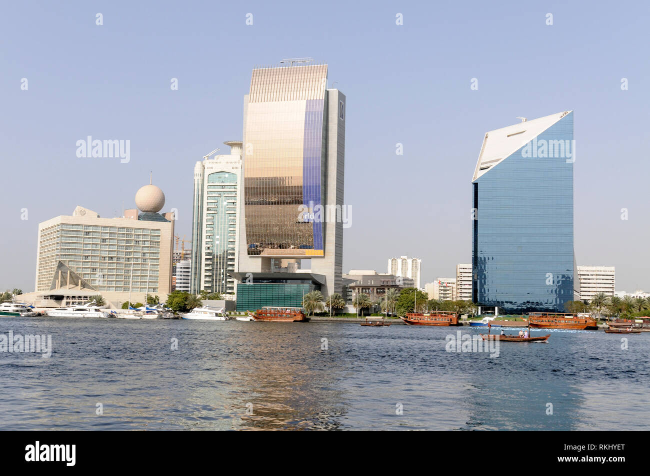 Across the Dubai Creek are L- R: The Sheraton Dubai Creek Hotel & Towers, Emirates NBD Head Office & Main Office Branch, Dubai Chamber Of Commerce & I Stock Photo