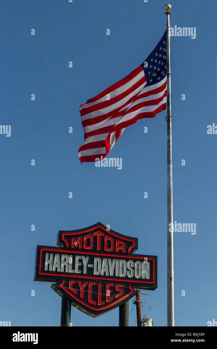 Harley-Davidson motorcycles sign beside a United States flag and flag pole, Las Vegas, Nevada, United States. Stock Photo