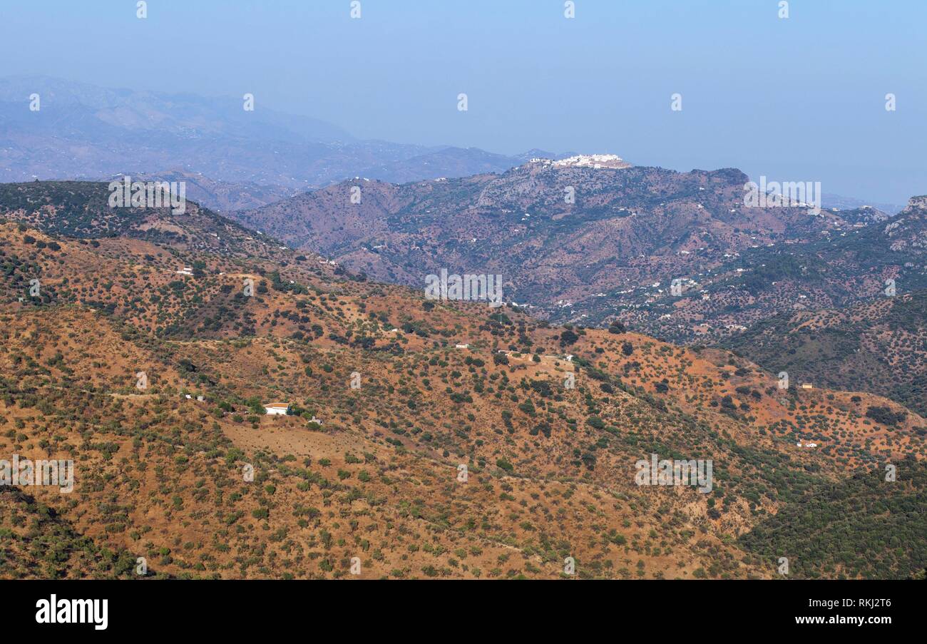 Aerial view of Comares, white village up on the hill of Malaga mountains, Andalusia, Spain. Panoramic. Stock Photo