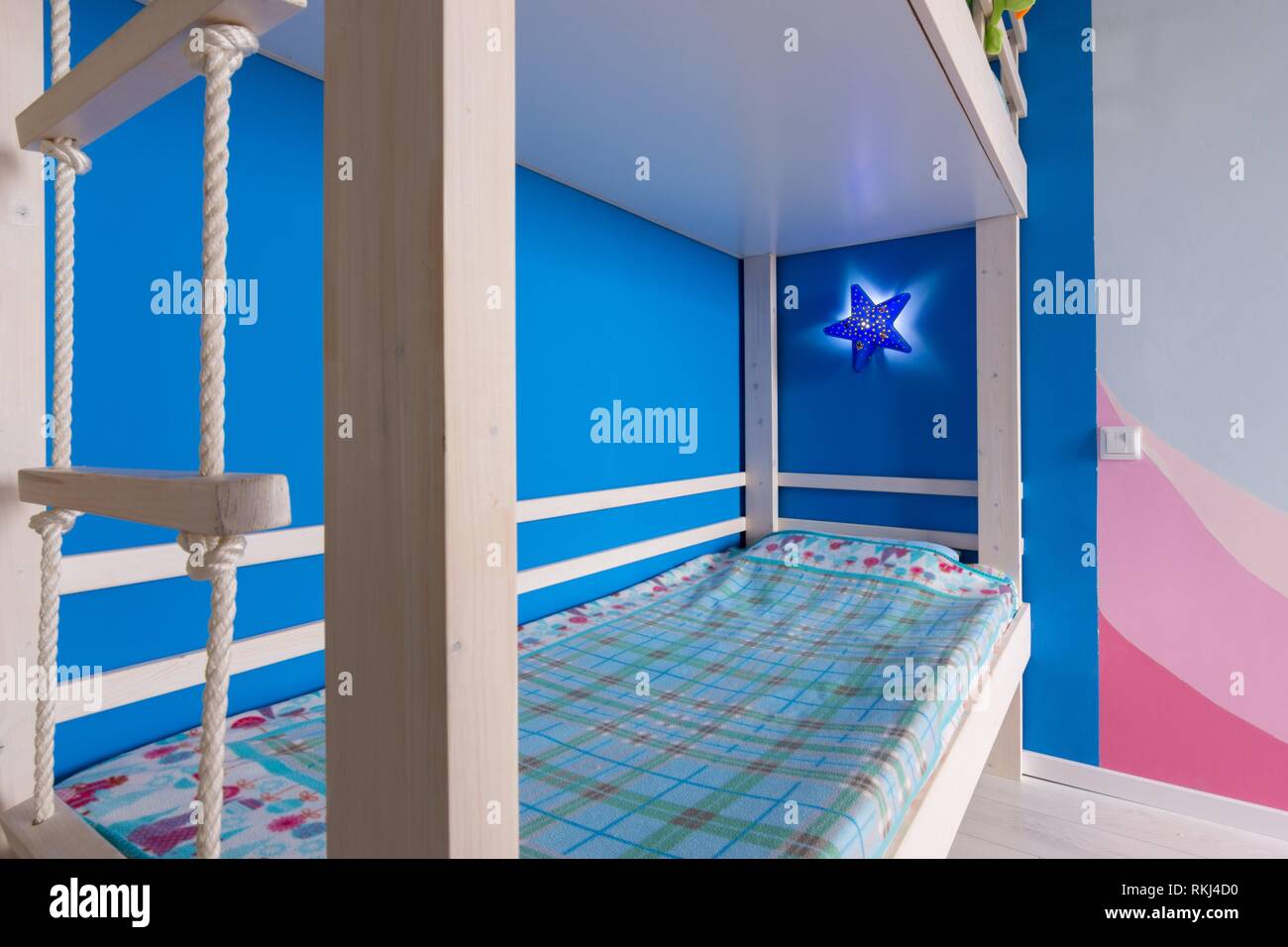 Lower berth and rope ladder to the top of the children's bunk bed Stock Photo Alamy