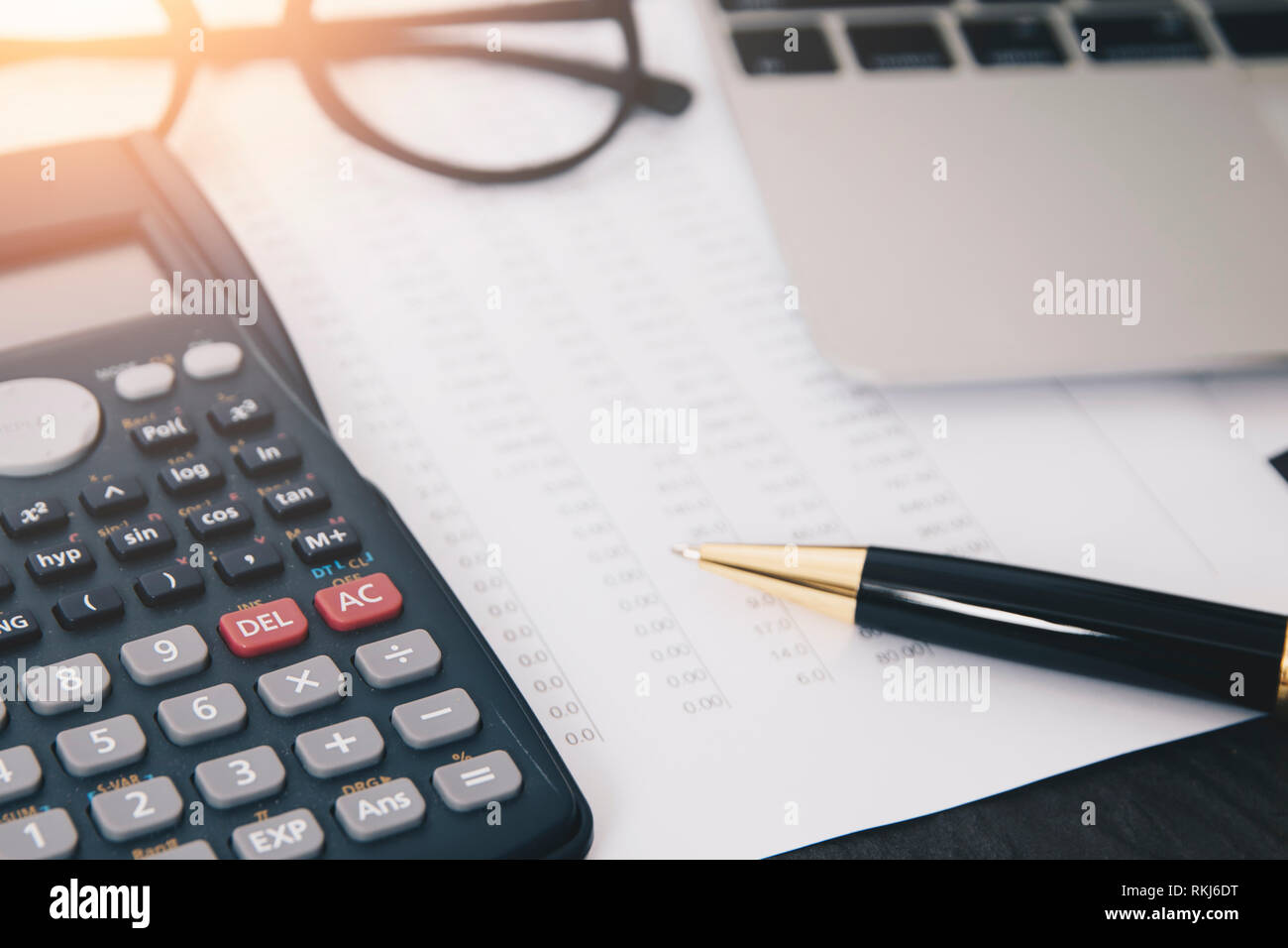 Financial accounting analysis concept ,Close up calculator and accounting laptop on office desk Stock Photo