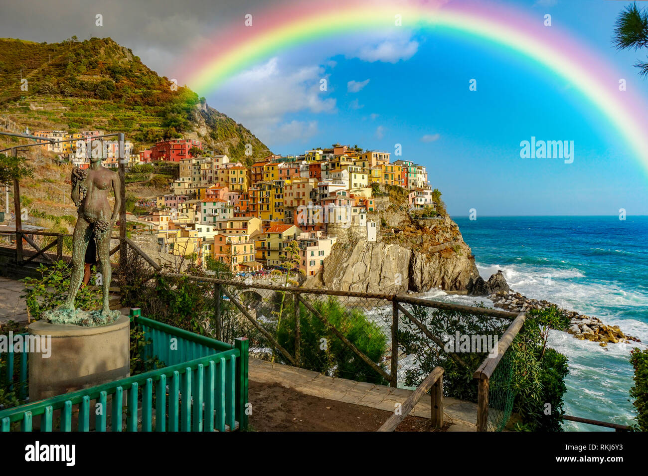 Beautiful italian Coast Cinque Terre Manarola with rainbow sunny and cloudy sky Stock Photo