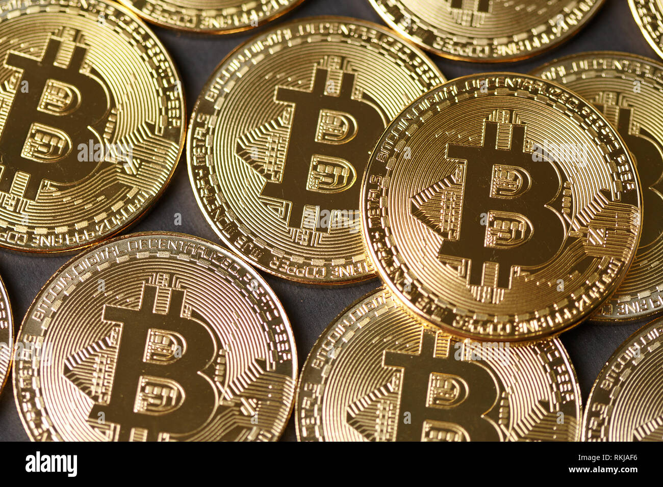 Bitcoins and New Virtual money concept.Stack of Many gold bitcoins on  reflective surface.Golden coin with icon letter B.Mining or blockchain  technolog Stock Photo - Alamy