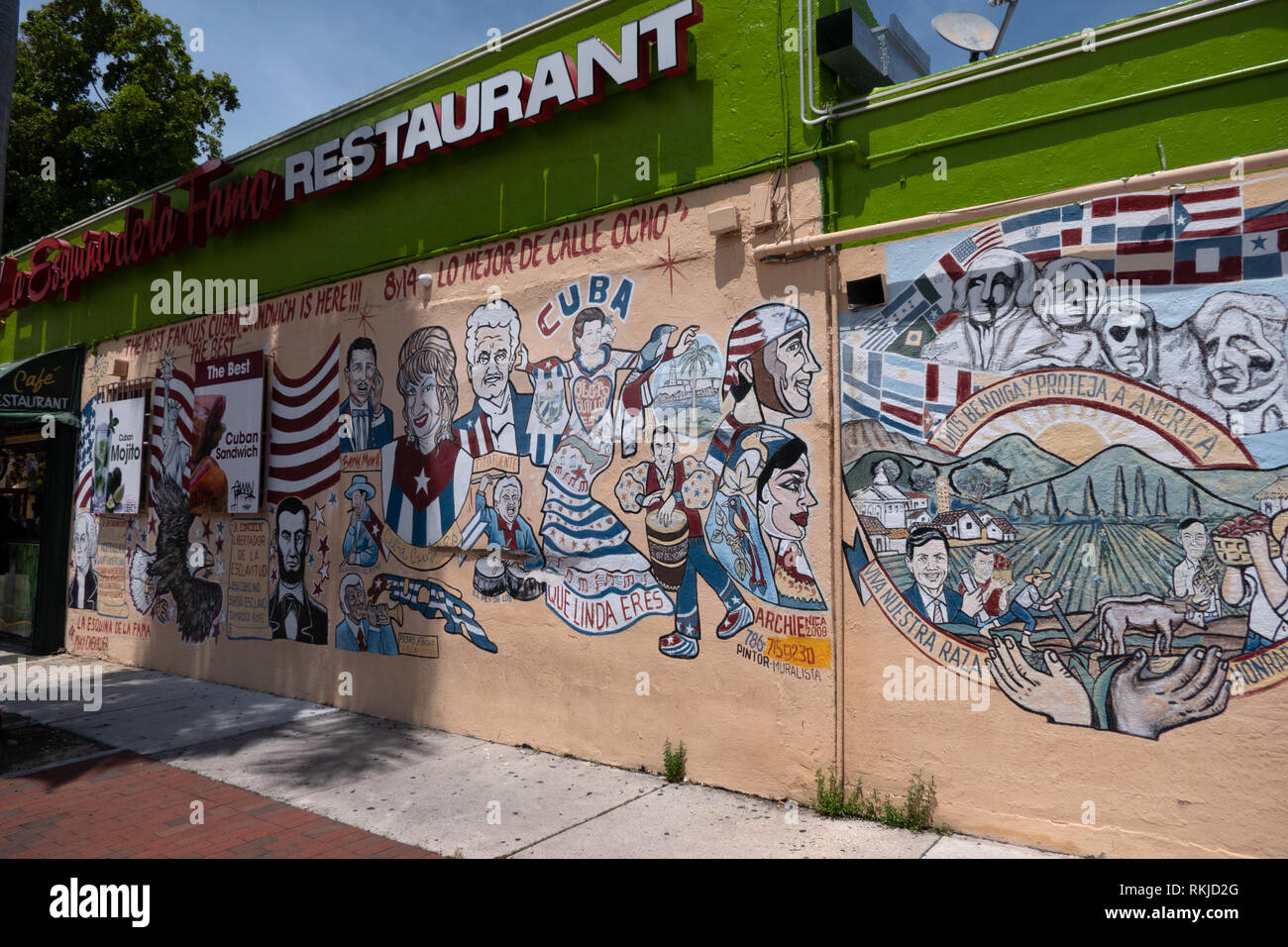 View of Calle Ocho in Little Havana district in Miami, Florida, USA with graffiti on wall of restaurant Stock Photo
