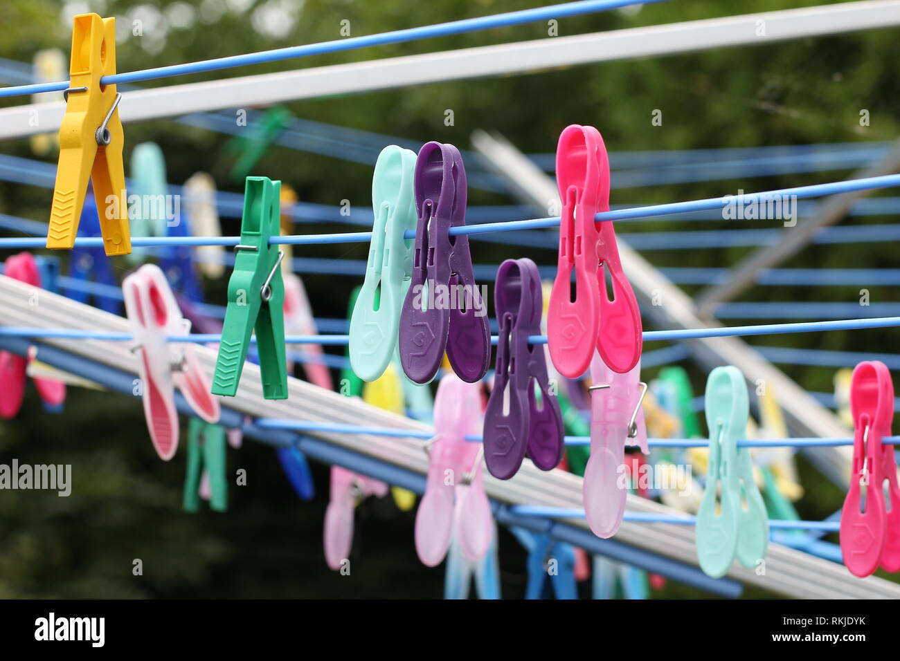 Close up of a colored clothespins on a clothesline Stock Photo