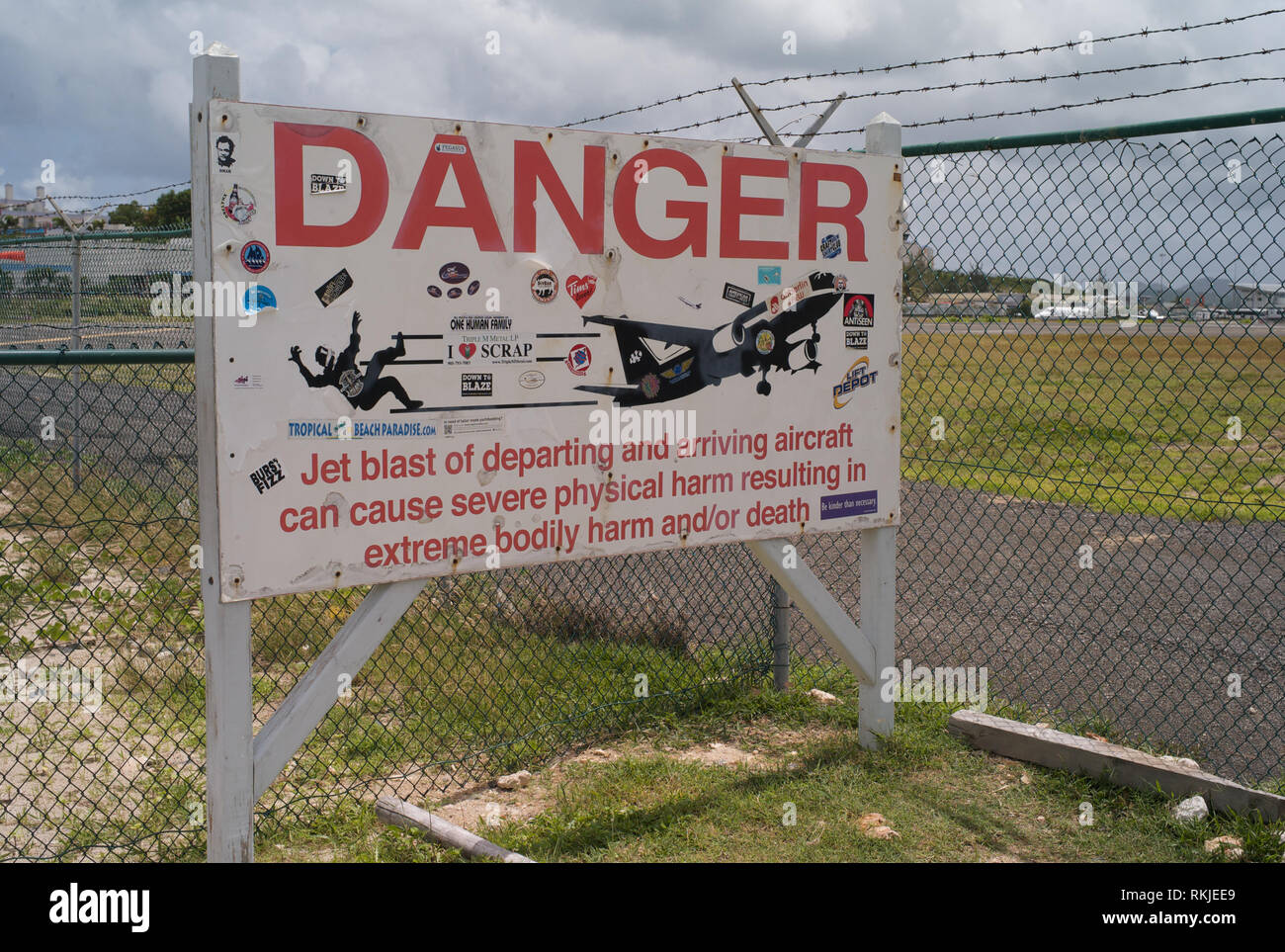 Maho Beach, Sint Maarten - July 16 2016: Danger sign warning of the jet engine blast on Maho Beach, near Princess Juliana Airport, Sint Maarten. Stock Photo