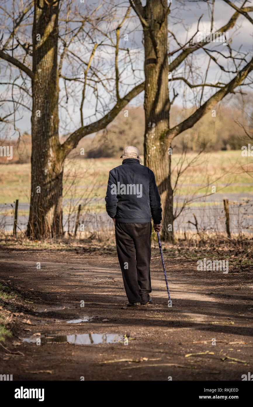 Old man walking down country track hi-res stock photography and images ...