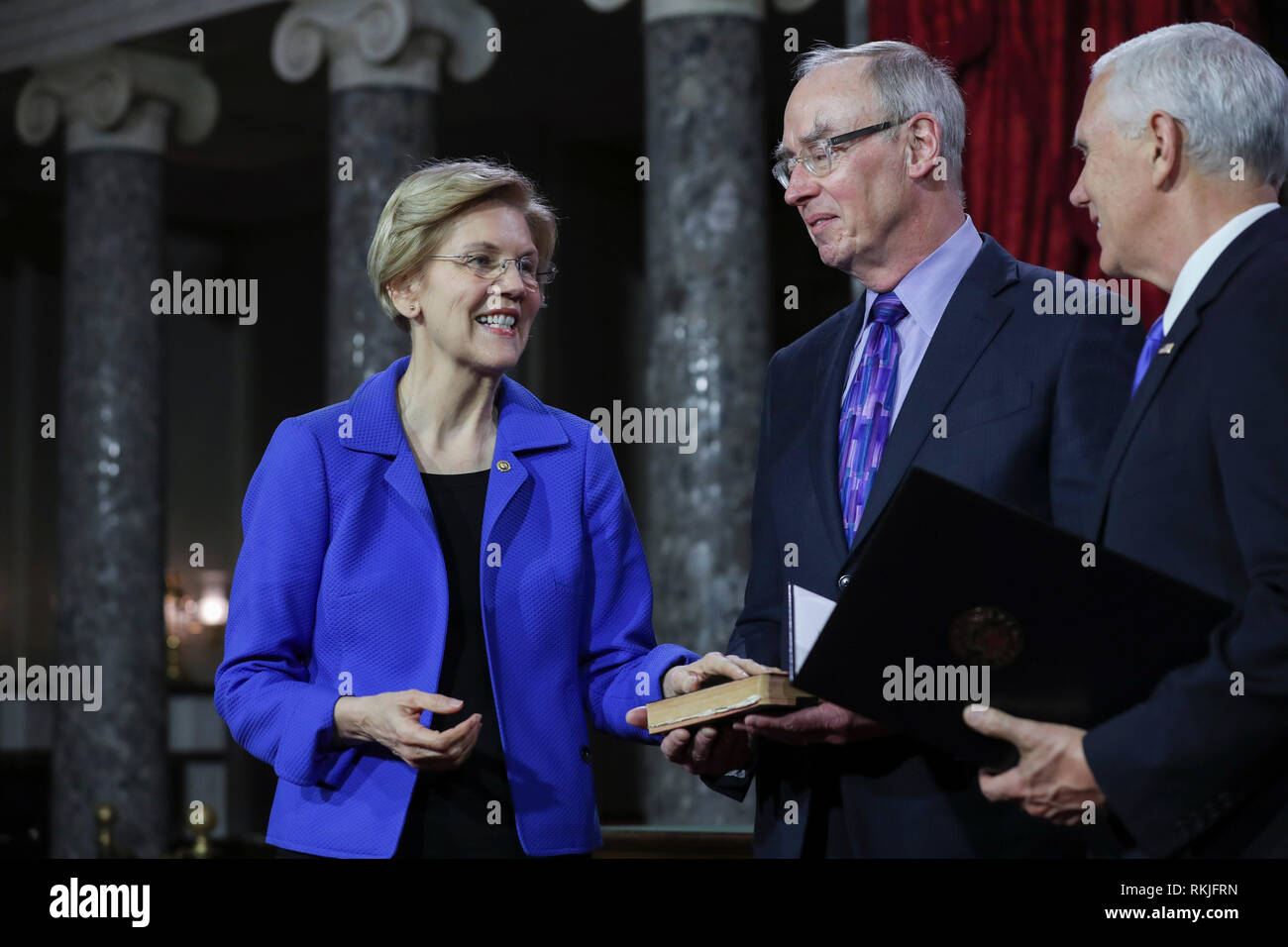 US Senator Elizabeth Warren, Democrat of Massachusetts, is sworn in by Vice President Mike Pence on Capitol Hill in Washington, DC on January 3, 2019. Stock Photo