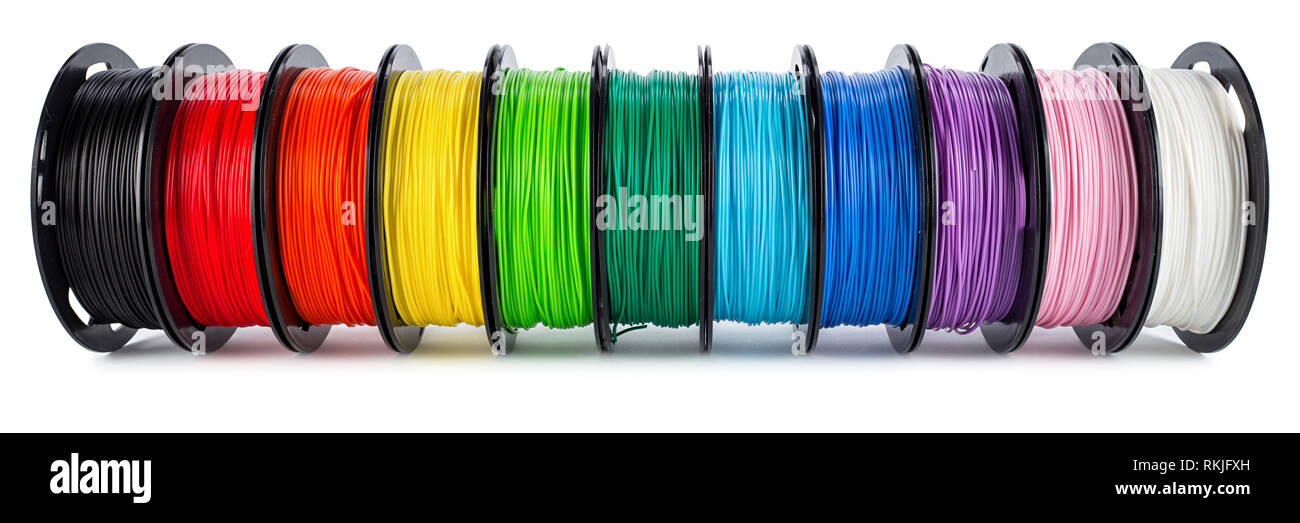 colorful bright wide panorama row of spool 3d printer pla abs filament plastic material isolated on white background Stock Photo