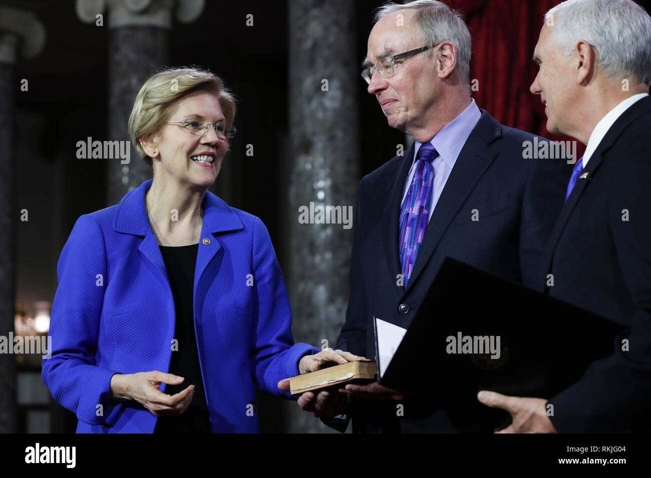 US Senator Elizabeth Warren, Democrat of Massachusetts, is sworn in by Vice President Mike Pence on Capitol Hill in Washington, DC on January 3, 2019. Stock Photo