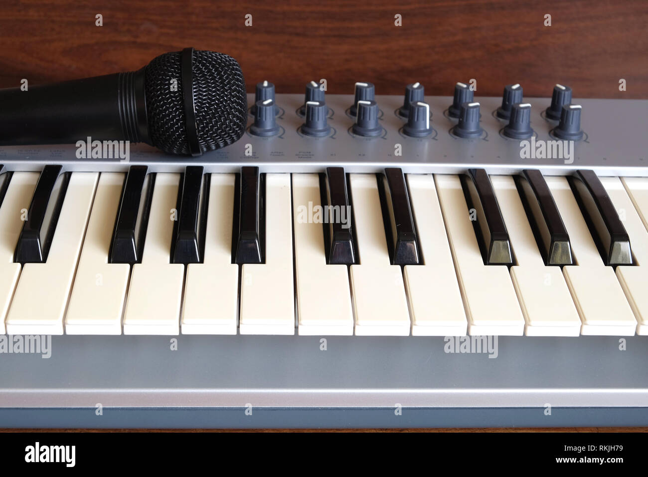 Music recording set with a microphone, keyboard, mouse and laptop. Internet  musician r influencer set Stock Photo - Alamy