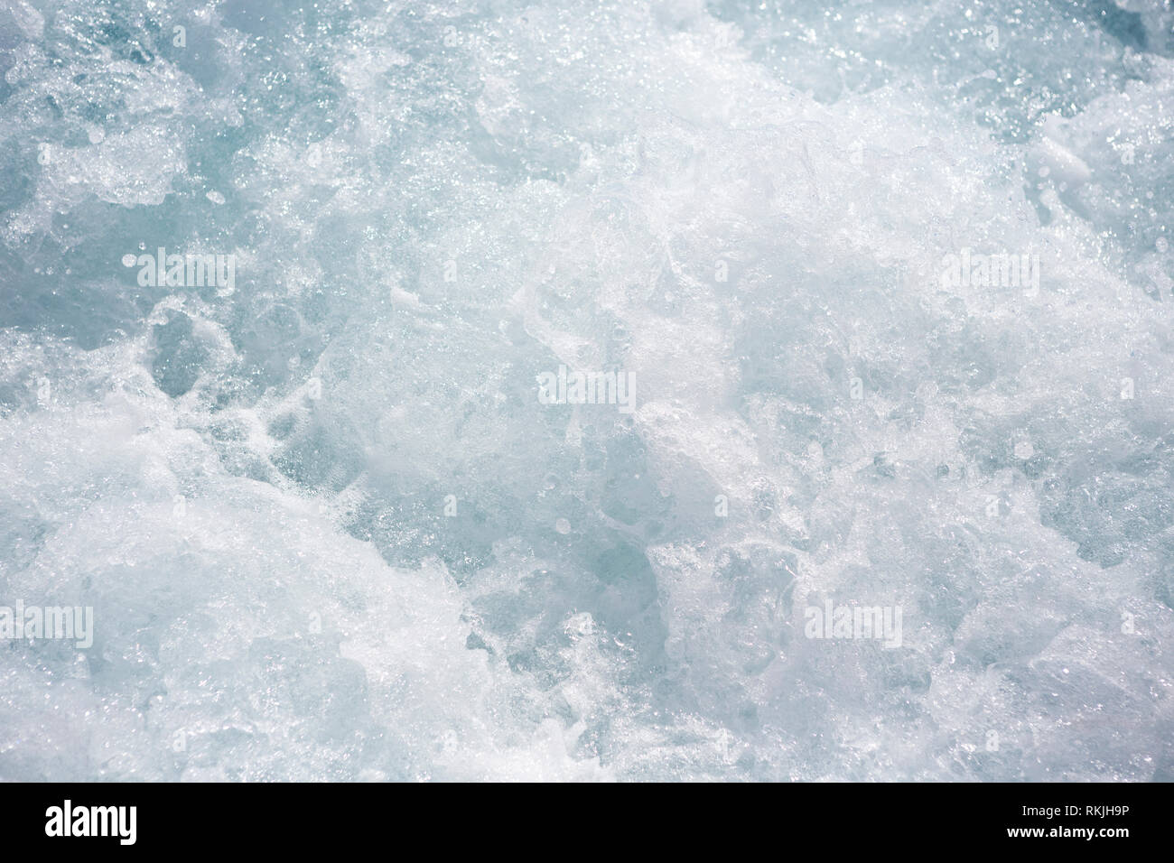 Churned up seawater, overhead and close-up Stock Photo