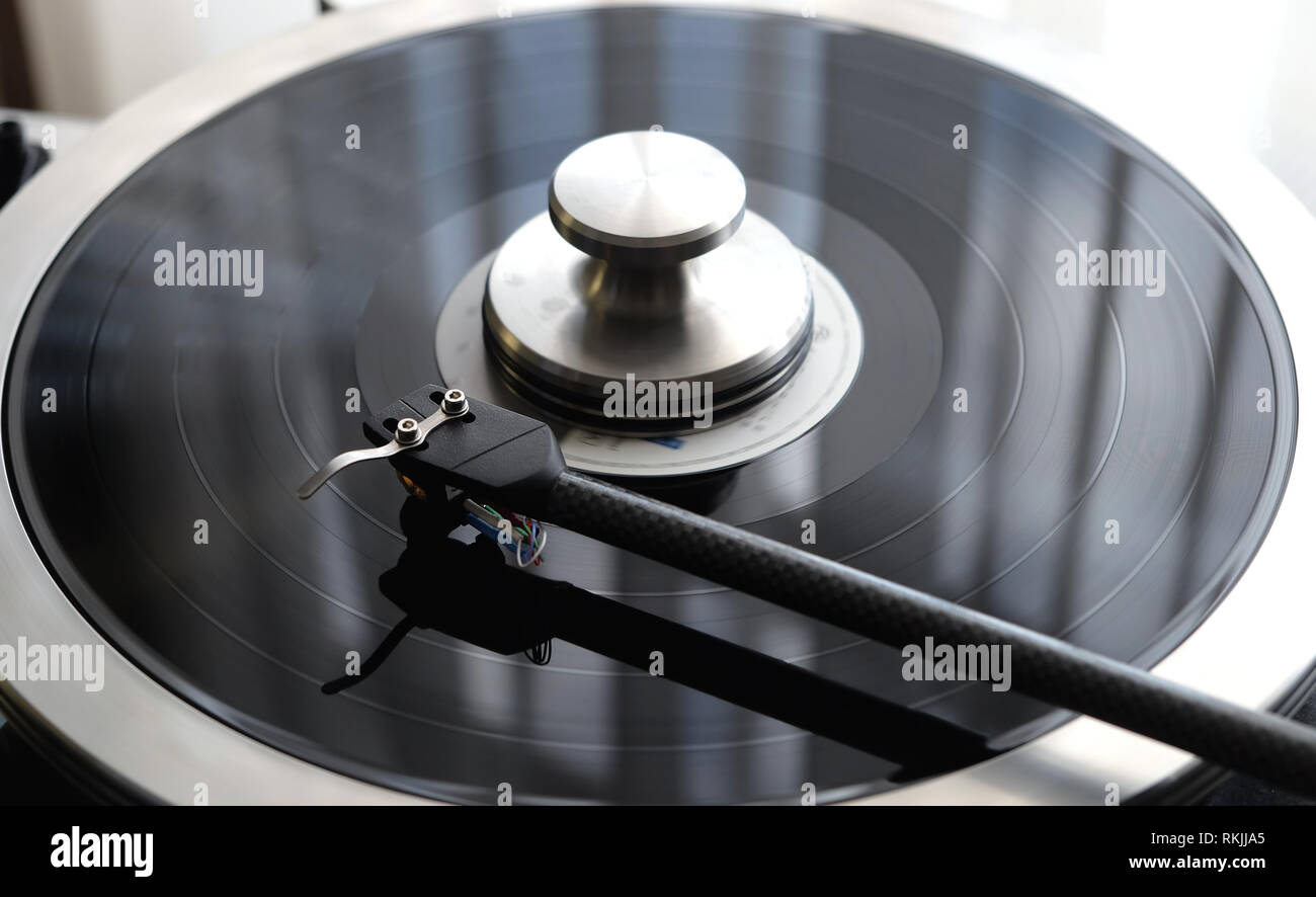 Graphite Tonearm Of Vintage Turntable With LP Record Close Up View Graphite Tonearm Of Vintage Turntable With LP Record Close Up View