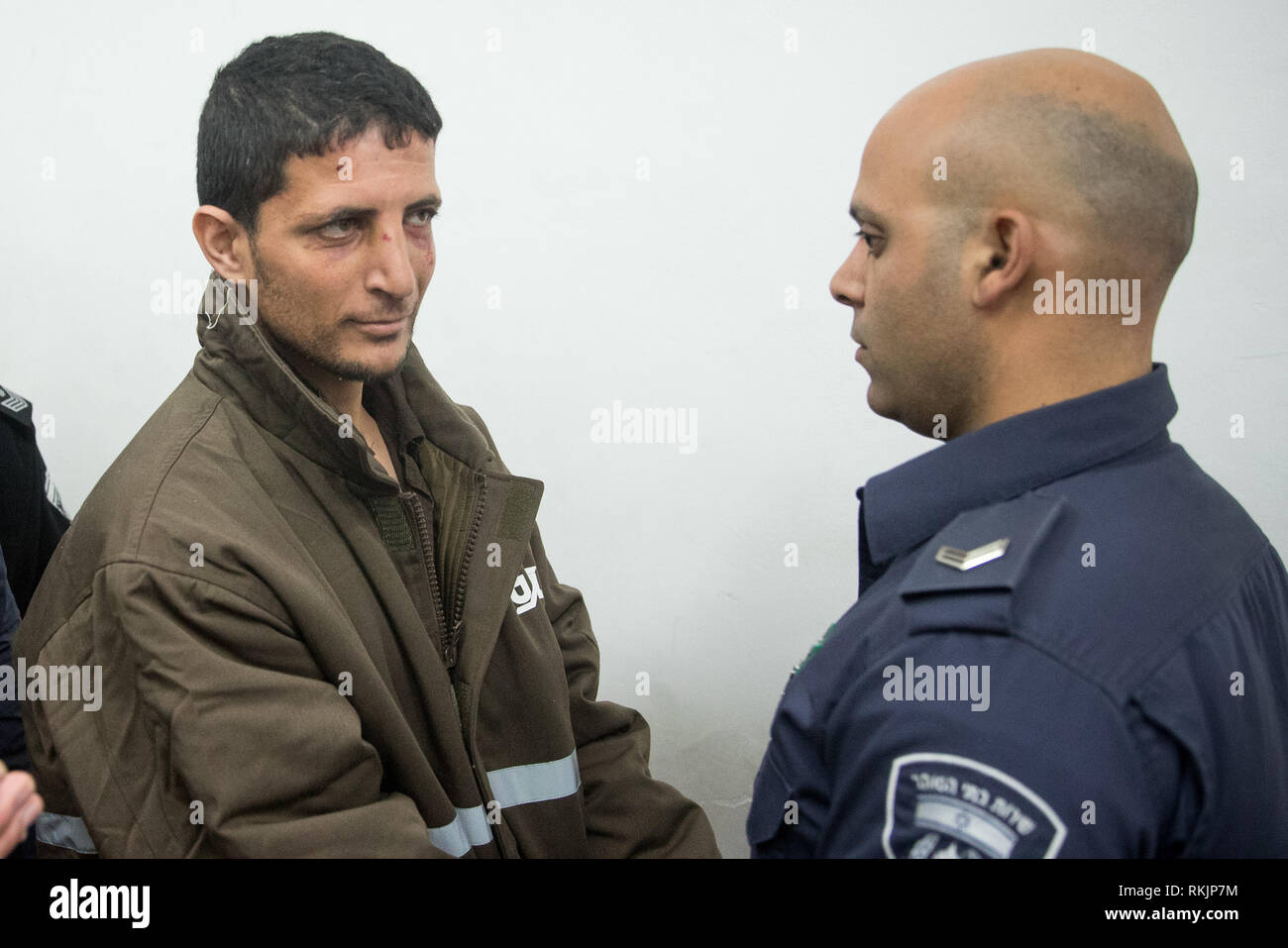 Jerusalem. 11th Feb, 2019. Arafat Irfayia (L) appears at a courtroom in Jerusalem, on Feb. 11, 2019. Israel's Shin Bet security service said on Sunday that the killing of a young Israeli woman last week was a 'terrorist attack' carried out by Arafat Irfayia. The Shin Bet said that the interrogation of Arafat Irfayia, arrested on Friday in the West Bank city of Ramallah, showed the killing was nationalistically-motivated. Credit: JINI/Xinhua/Alamy Live News Stock Photo