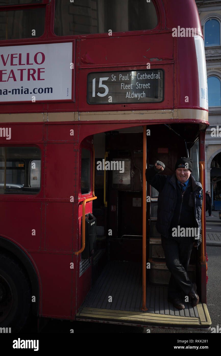 London, UK. 11th February 2019. Open platform at the rear of the heritage Routemaster red bus with conductor, still operating daily between Trafalgar Square and the Tower of London, until the 1st of March this year, when the bus will run only on weekends. Credit: Joe Kuis / Alamy Live News Stock Photo