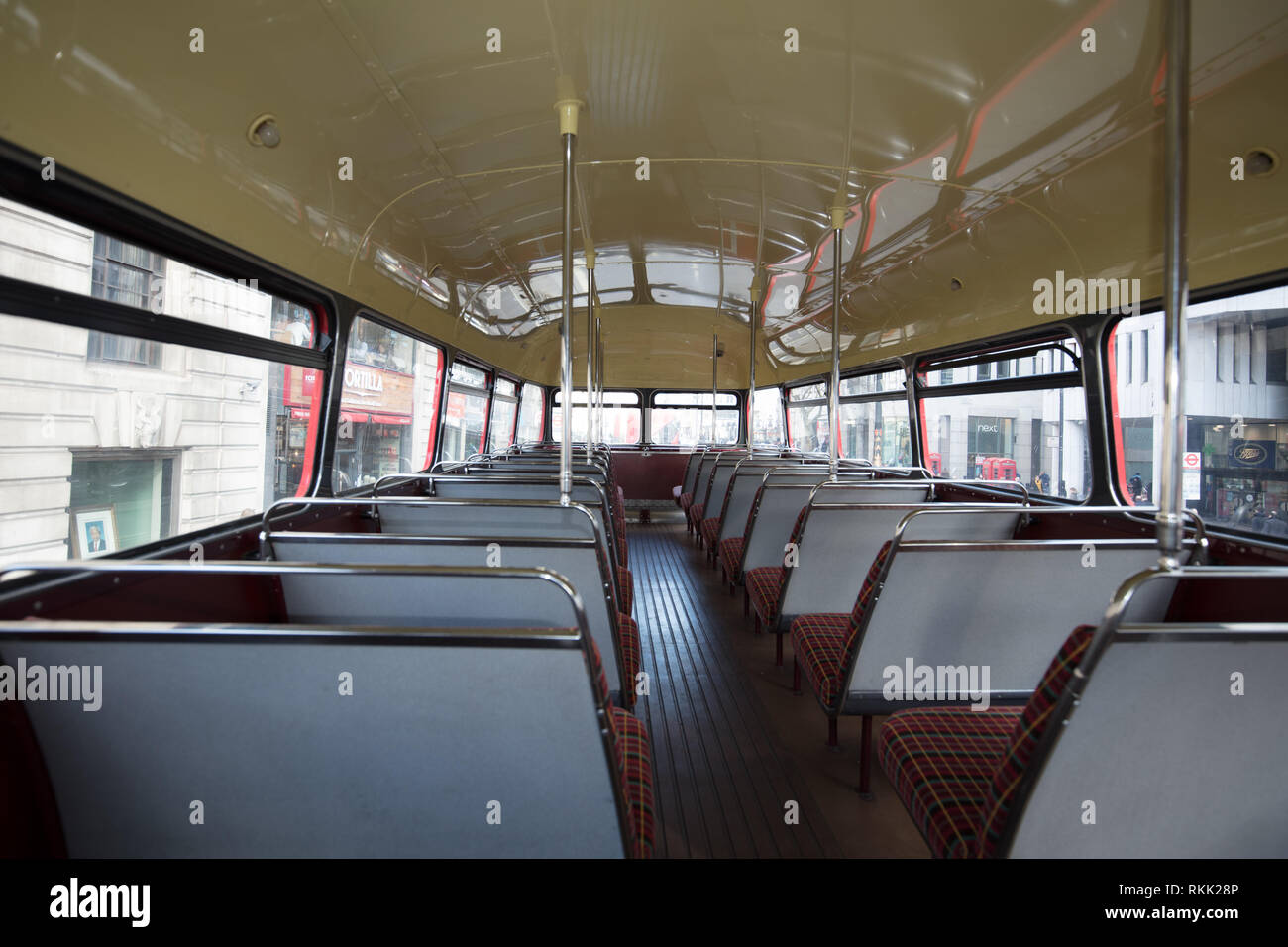 London, UK. 11th February 2019. Interior upper deck of the heritage Routemaster red bus with conductor, still operating daily  until the 1st of March this year, when the bus will run only on weekends. Credit: Joe Kuis / Alamy Live News Stock Photo