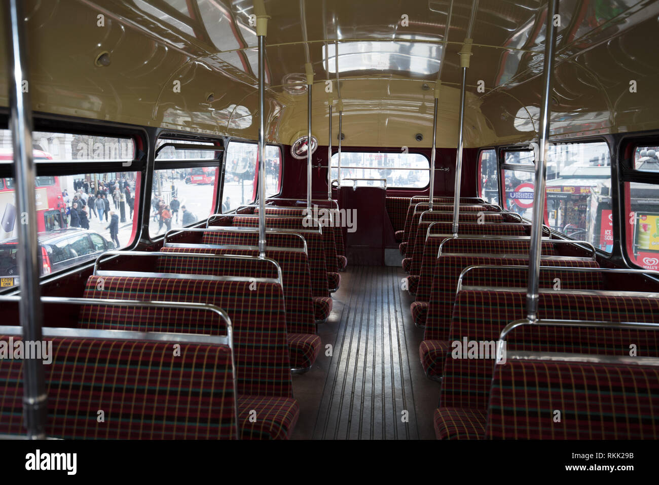 London, UK. 11th February 2019. Interior upper deck of the heritage Routemaster red bus with conductor, still operating daily between Trafalgar Square and the Tower of London, until the 1st of March this year, when the bus will run only on weekends. Credit: Joe Kuis / Alamy Live News Stock Photo