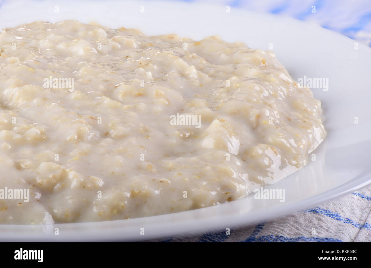 Healthy oatmeal closeup on a white plate Stock Photo