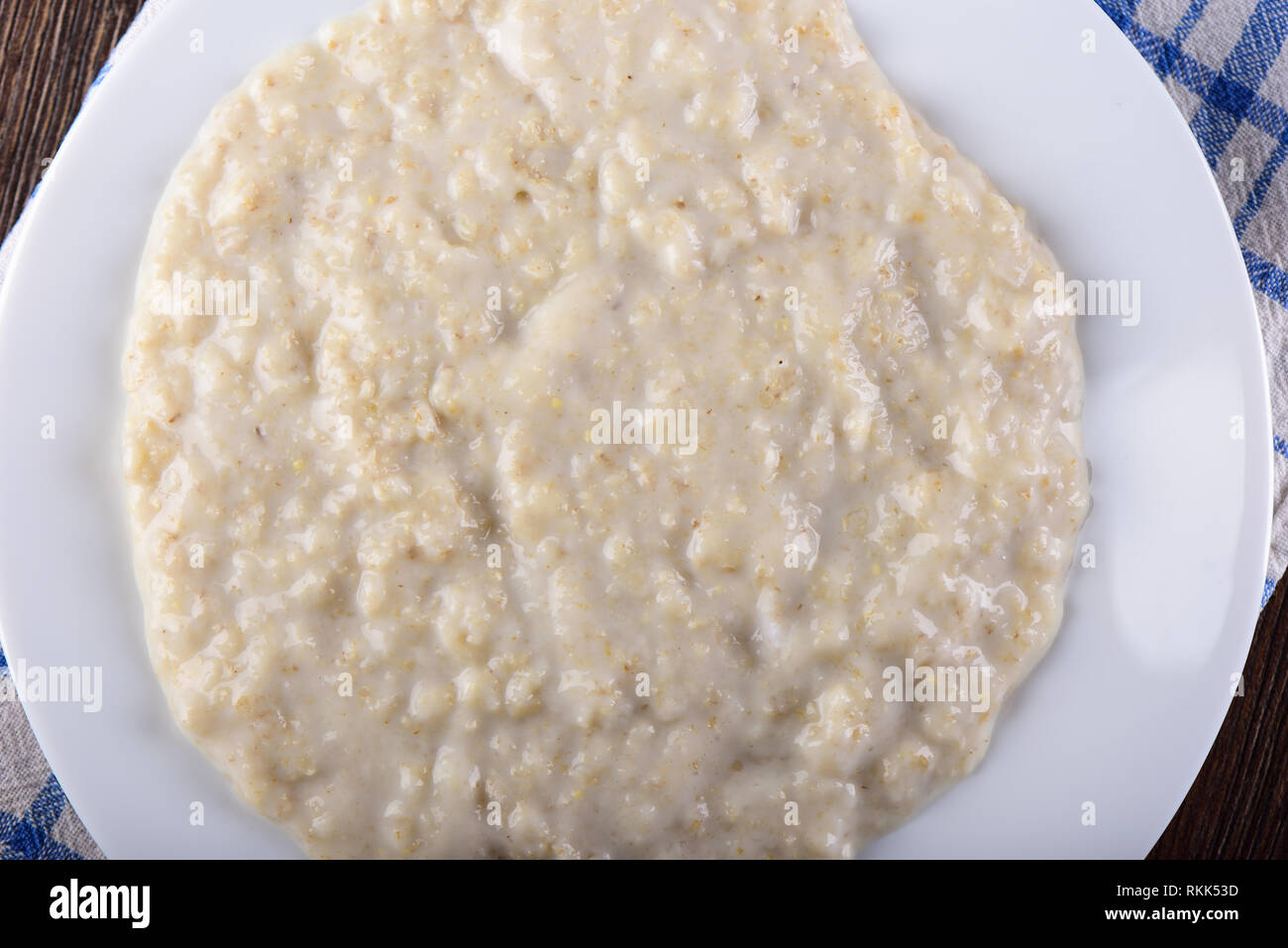 Top view. Healthy oatmeal closeup on a white plate Stock Photo