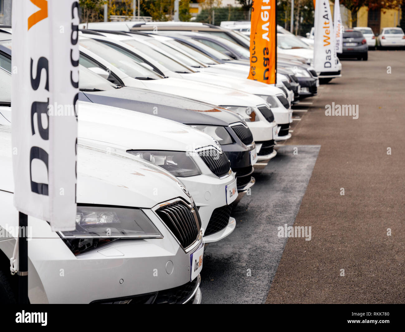 Strasbourg, France - Nov 7 2017: Perspective view - rows of new cars for sale large stock in wide parking lot - Czech Skoda car dealer inventory Stock Photo