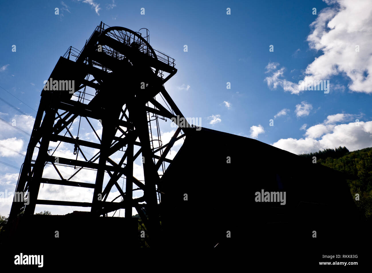 Head frame and winding house of former historic deep coal mine Hetty Pit Grade 1 listed and scheduled monument at Hopkinstown near Pontypridd Glamorgan South Wales UK Stock Photo