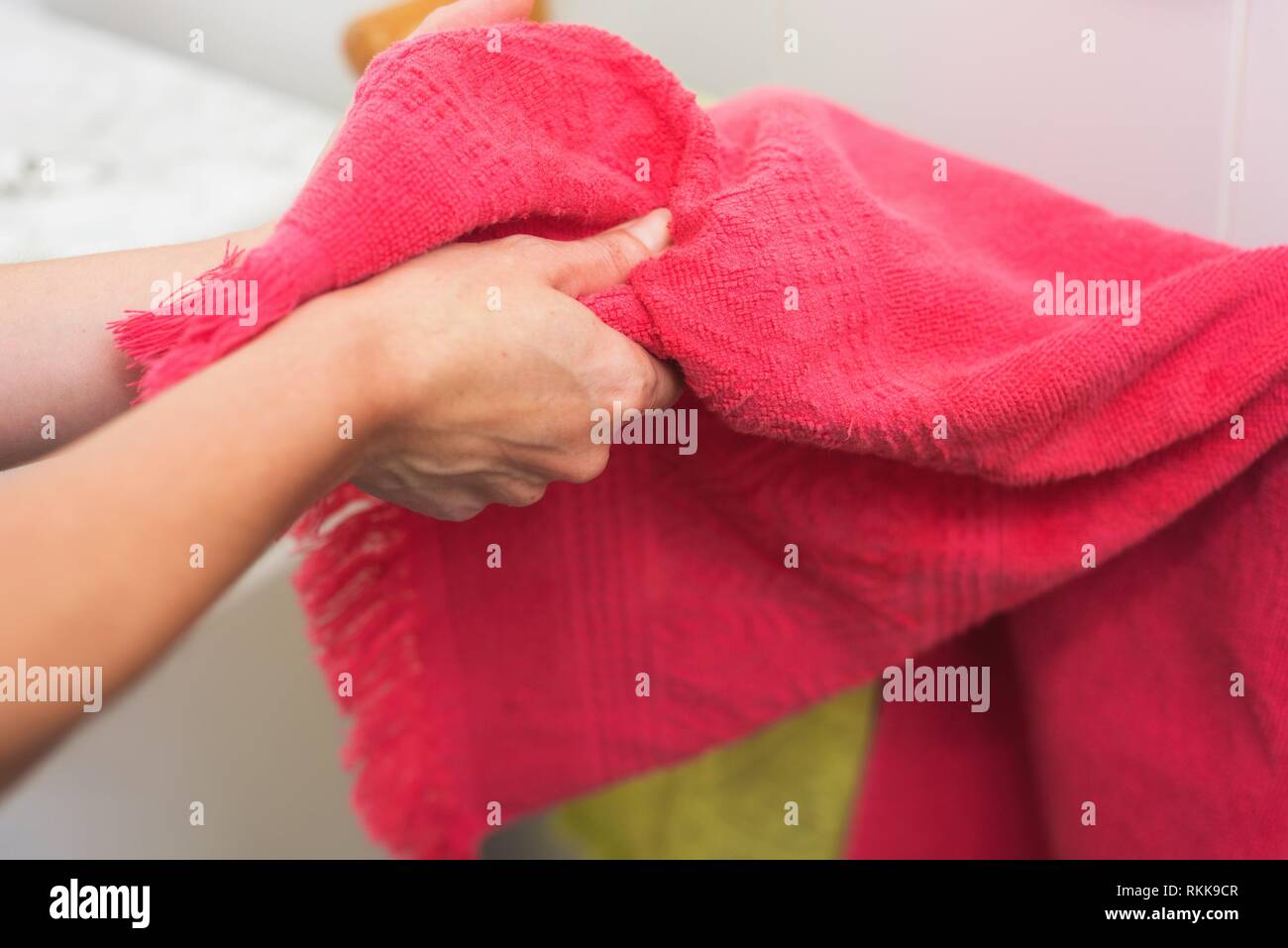 Woman drying hands with towel. Stock Photo