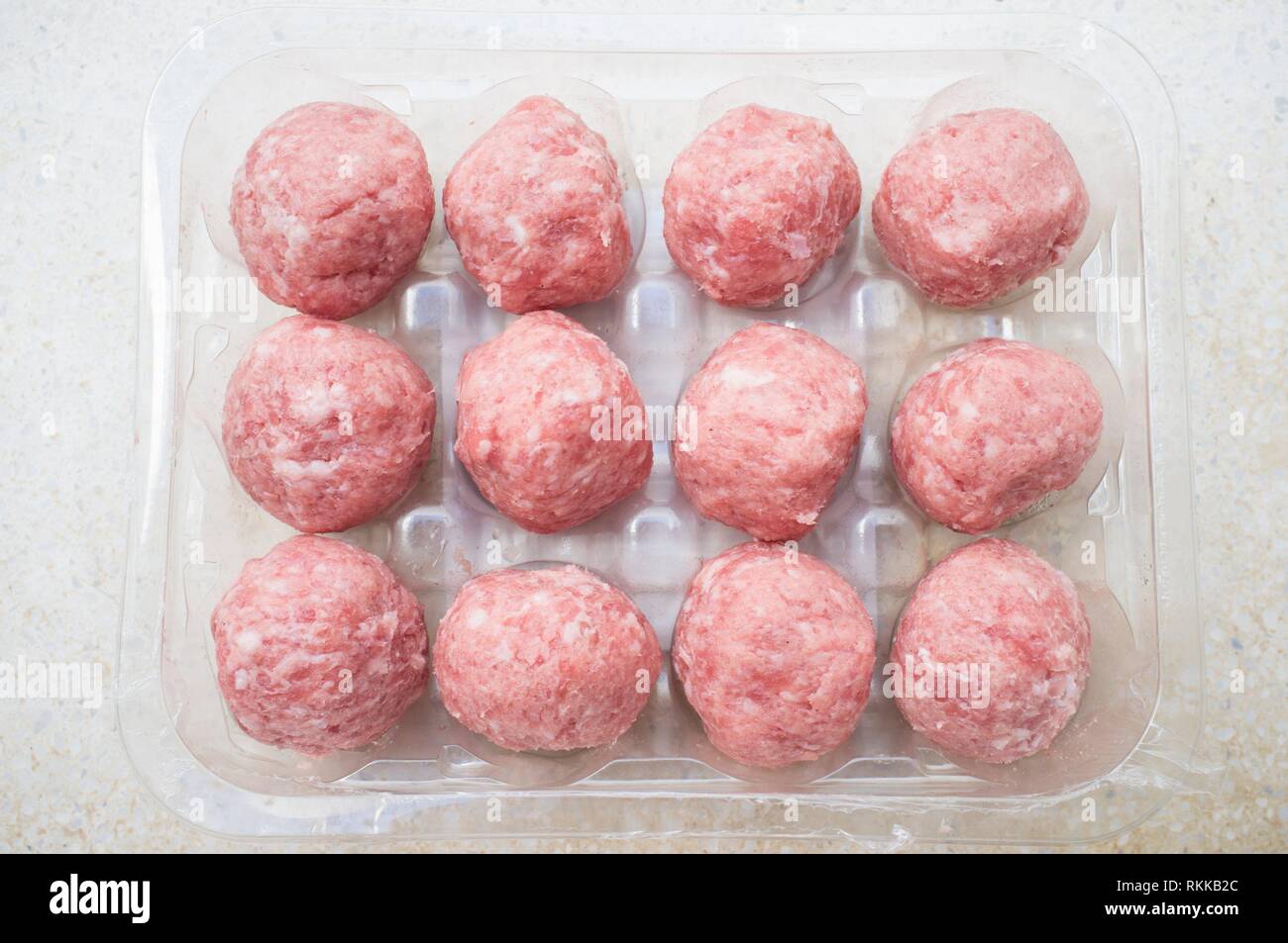 Pork meat balls in his package. Overhead view. Stock Photo