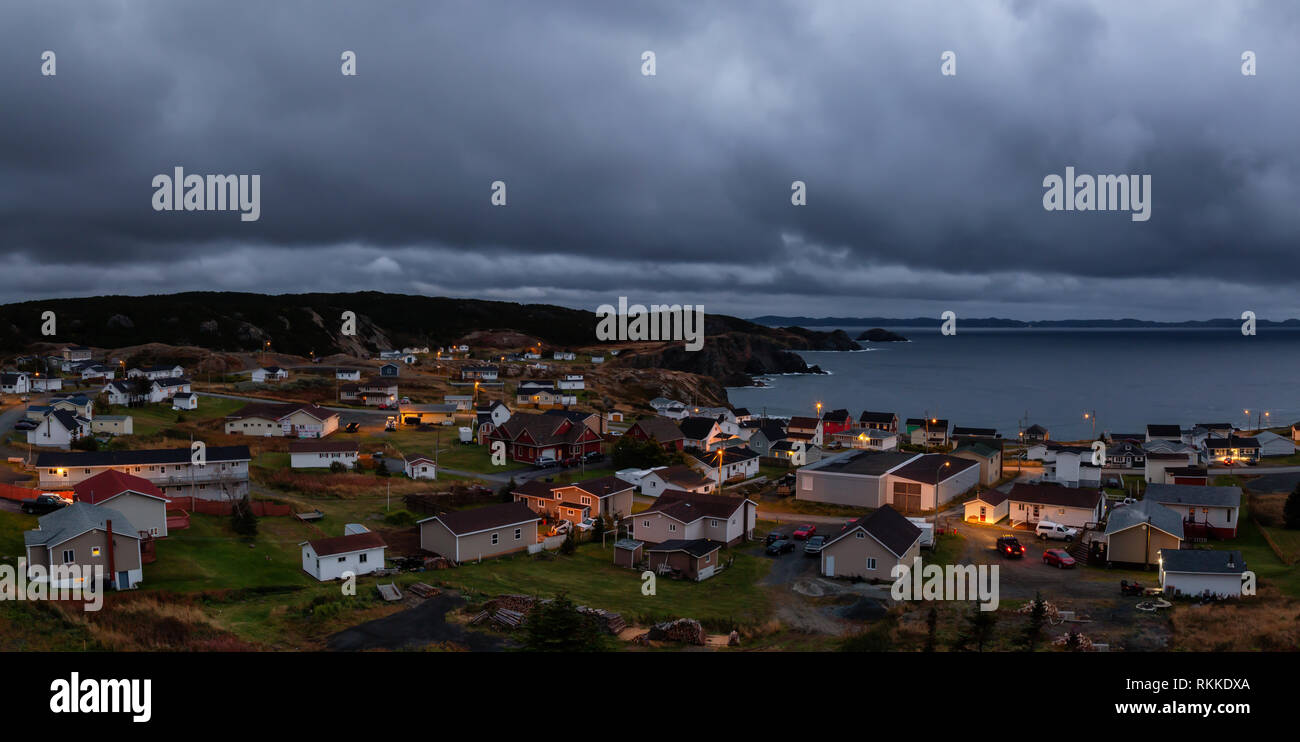 Panoramic view of a small town on the Atlantic Ocean Coast during a cloudy evening. Taken in Crow Head, North Twillingate Island, Newfoundland and Lab Stock Photo