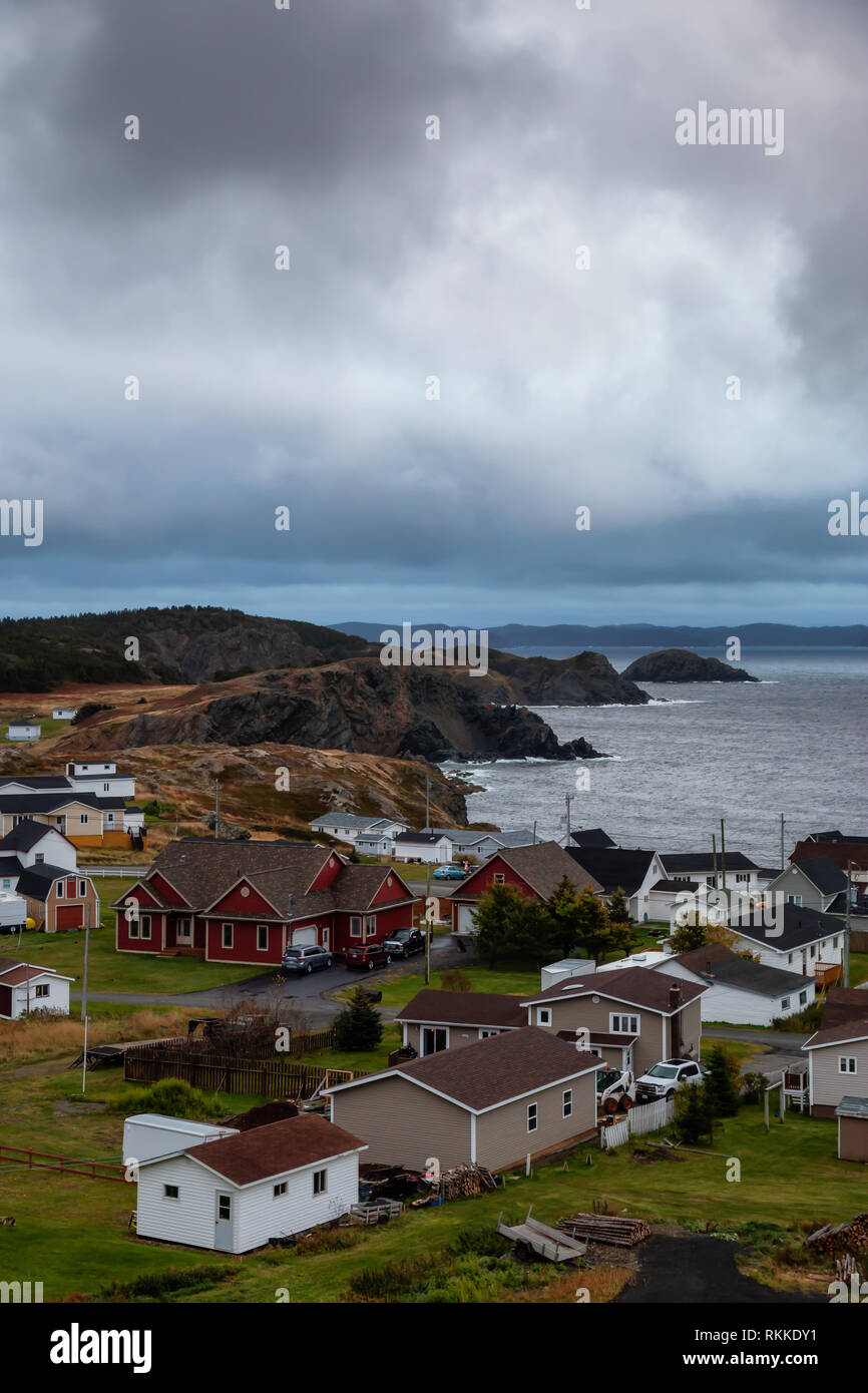 Beautiful view of a small town on the Atlantic Ocean Coast during a cloudy evening. Taken in Crow Head, North Twillingate Island, Newfoundland and Lab Stock Photo