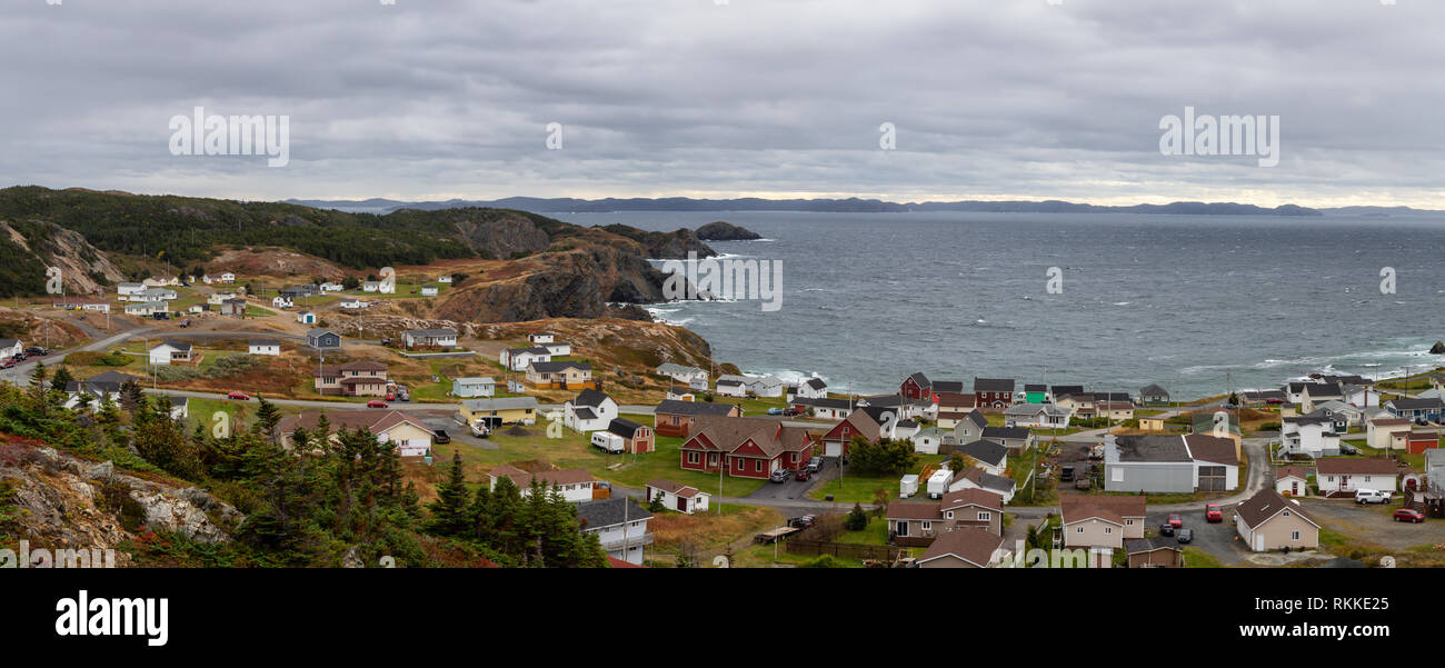 Panoramic view of a small town on the Atlantic Ocean Coast during a cloudy evning. Taken in Crow Head, North Twillingate Island, Newfoundland and Labr Stock Photo
