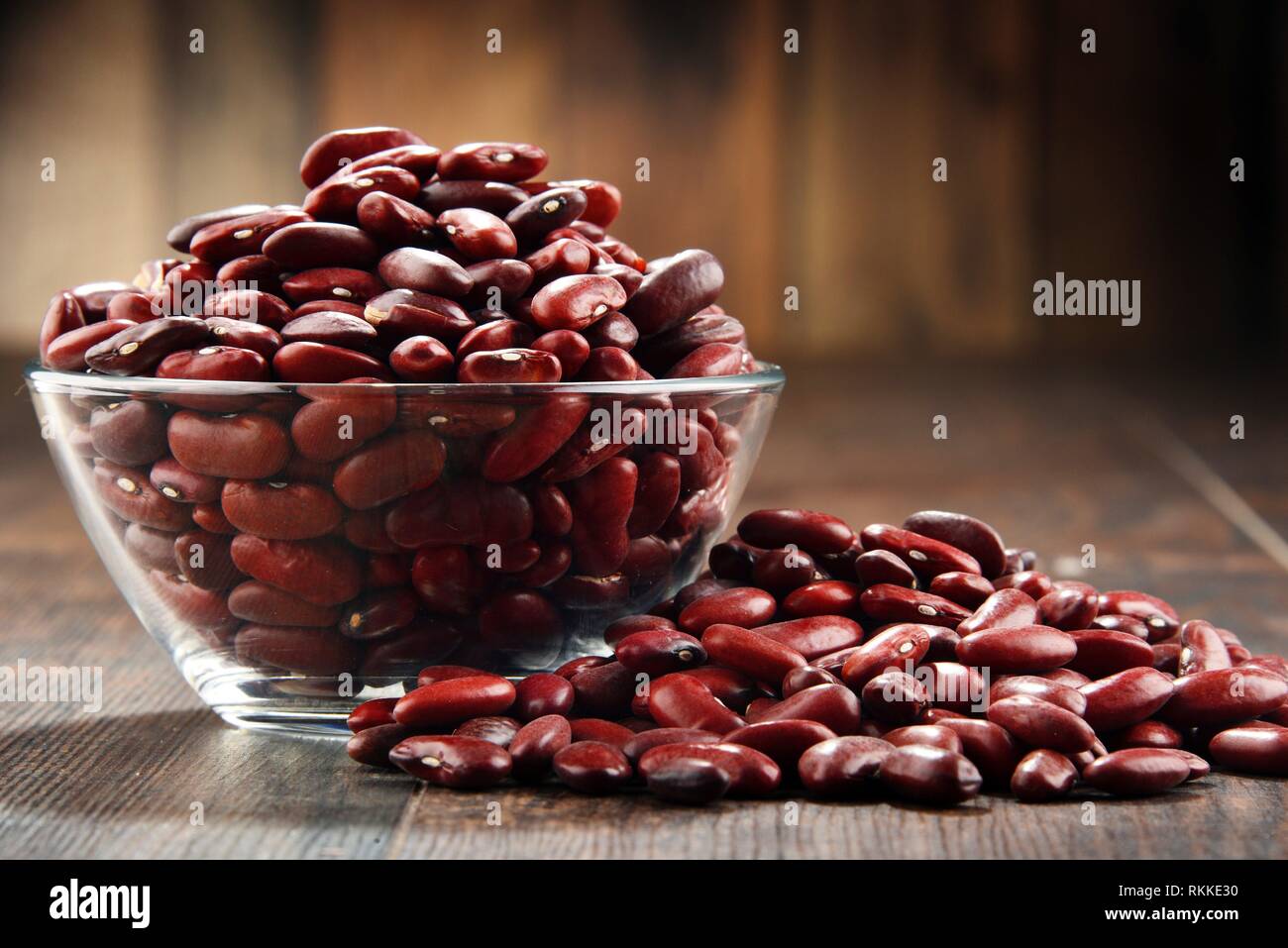 Composition with bowl of kidney bean on wooden table. Stock Photo