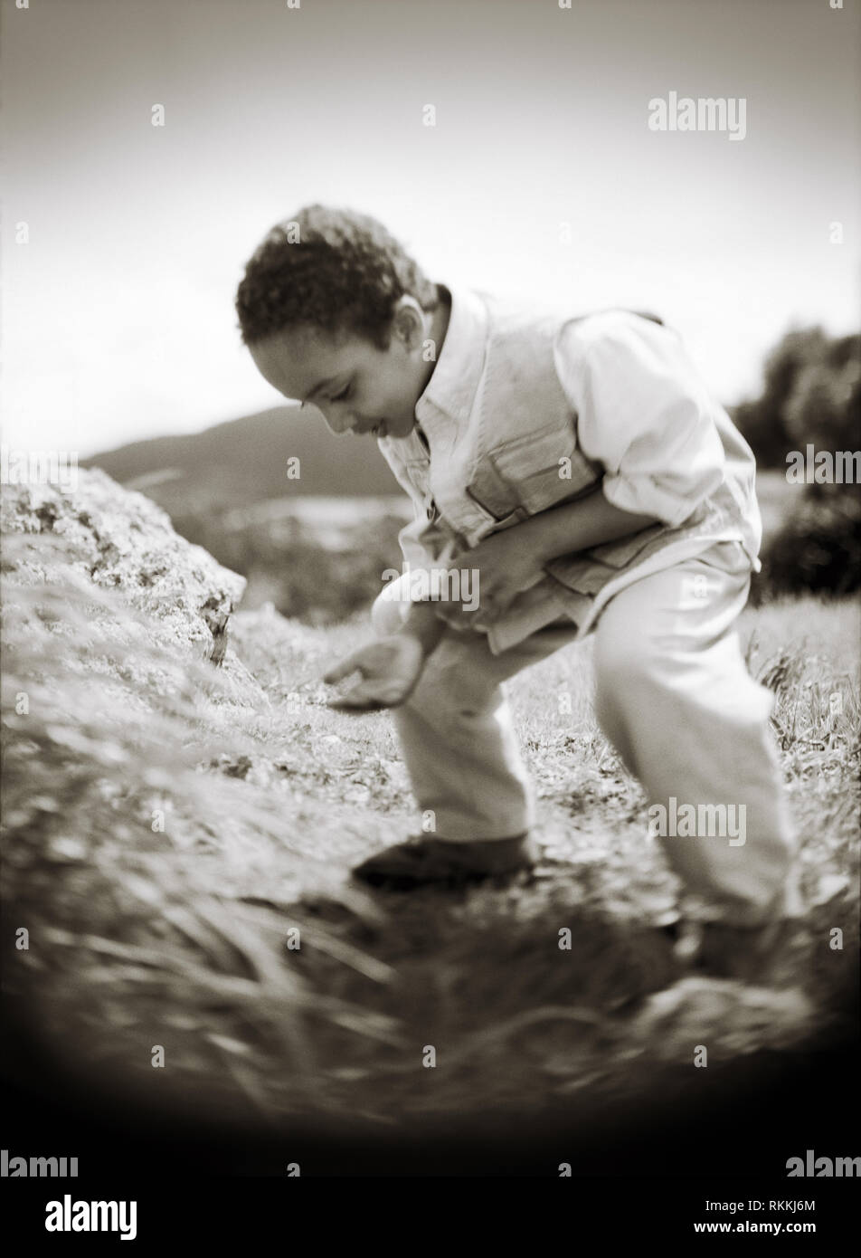 Searchingly Kid on a ground hi-res stock photography and images - Alamy