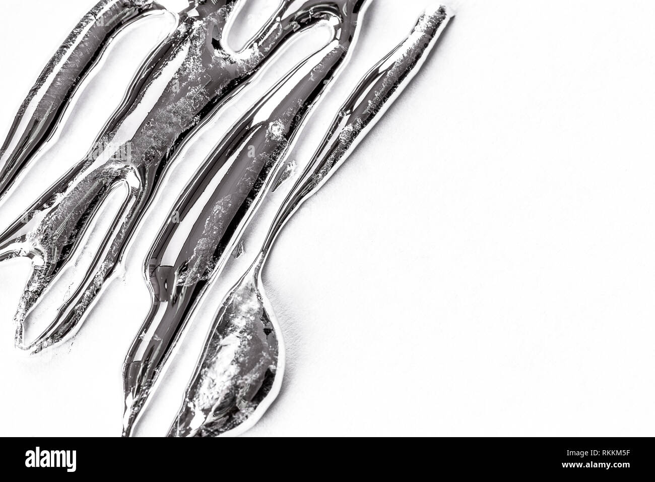 silver liquid metal on a white background Stock Photo Alamy