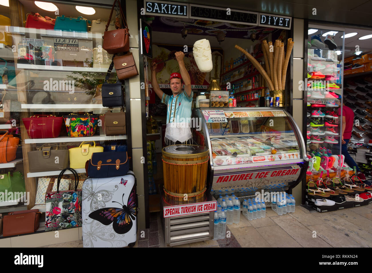 KUSADASI, TURKEY - MAY 23, 2015: A man in traditional Turkish costume sells ice cream on the street in Kusadasi, Turkey Stock Photo
