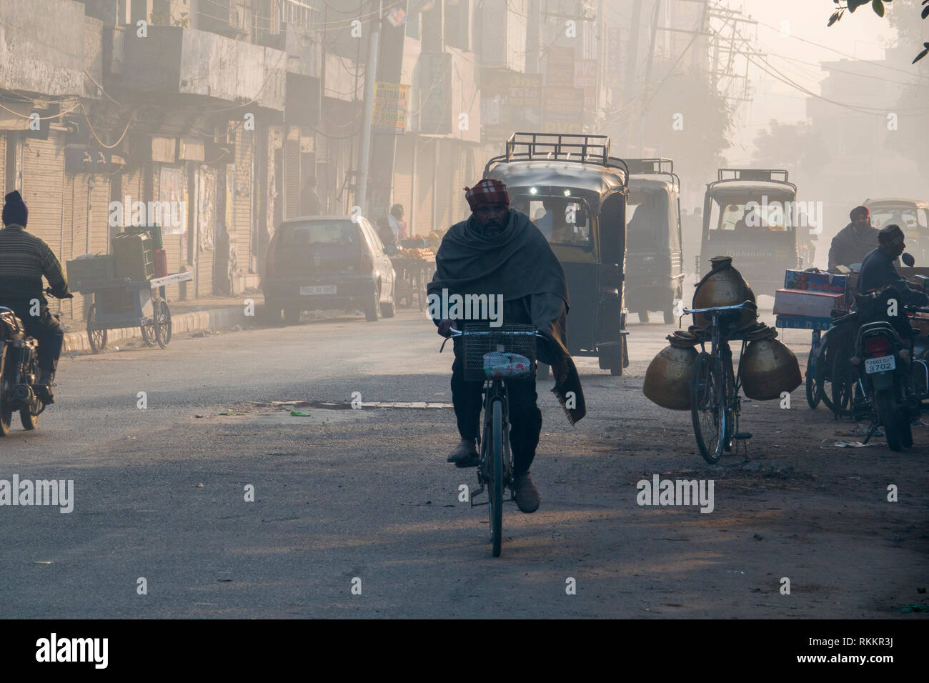 Auto rickshaws and other traffic on city street in Amritsar, India Stock Photo