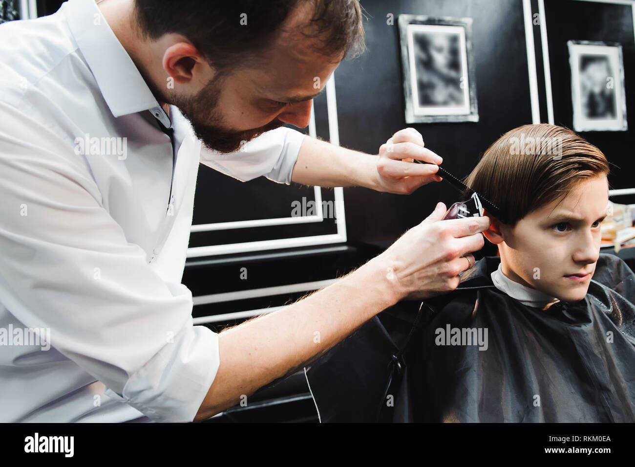 Cute Young Boy Getting A Haircut In A Salon Stock Photo 235852690