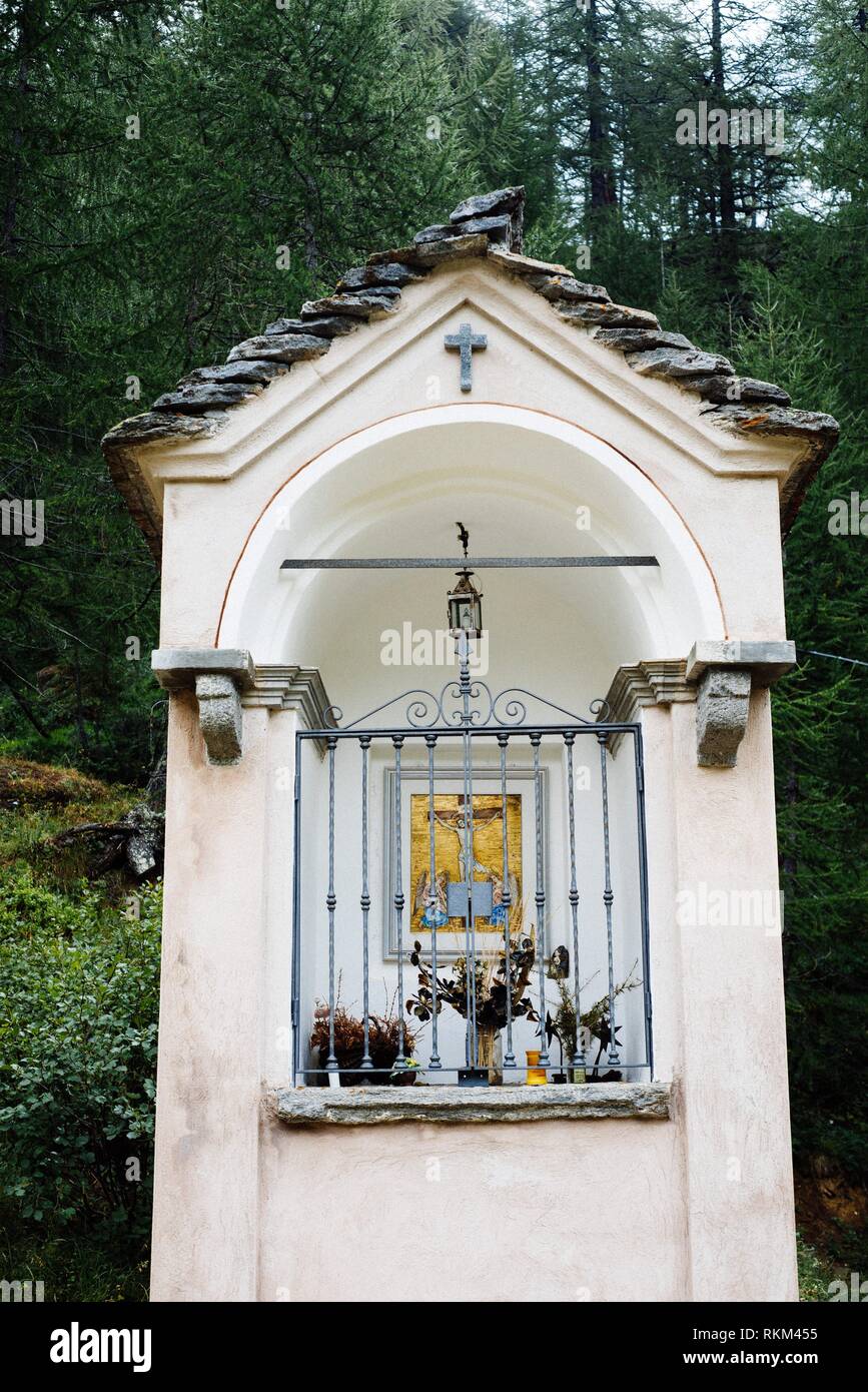 small votive chapel of the Madonna on the path of the Italian Alps