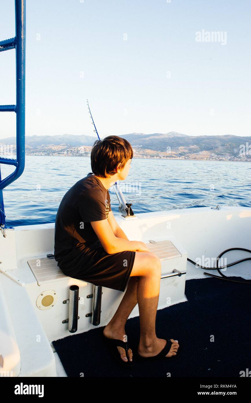 Boy fishing boat hi-res stock photography and images - Alamy