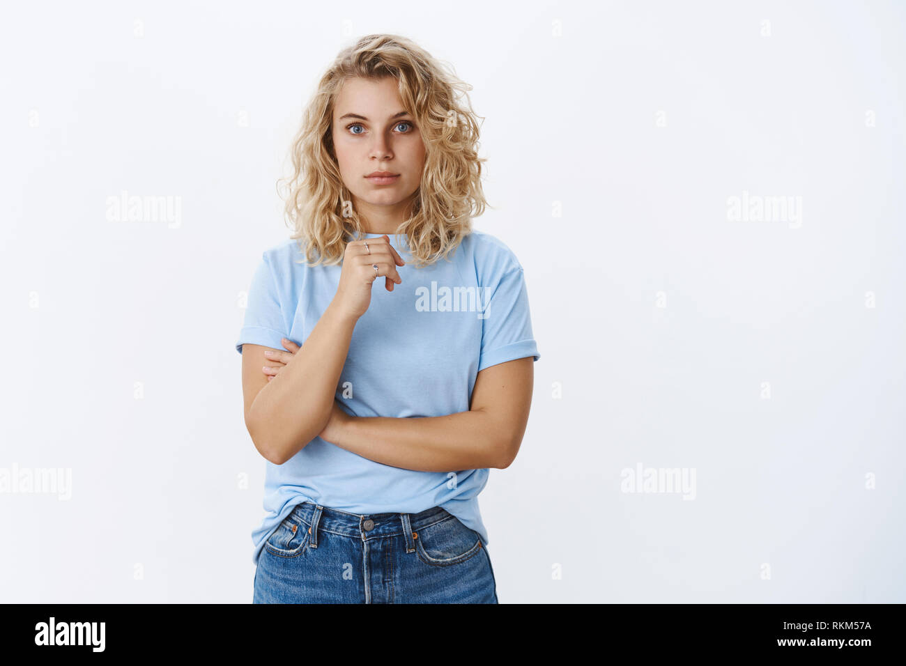 Studio Shot Of Attractive Young 20s Woman With Blond Curly Short
