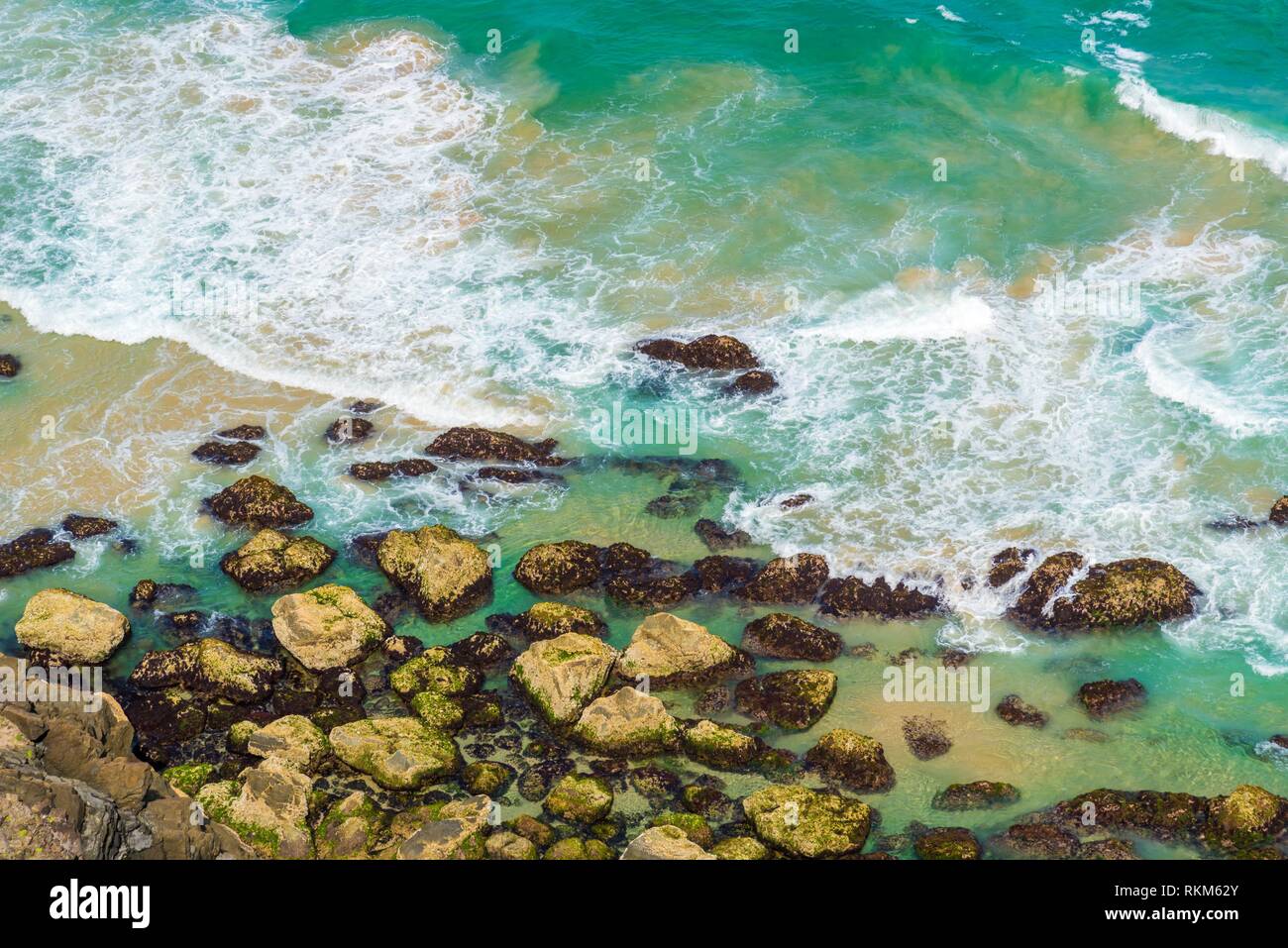 Aerial view over green turquoise water waves in Byron Bay, Australia ...