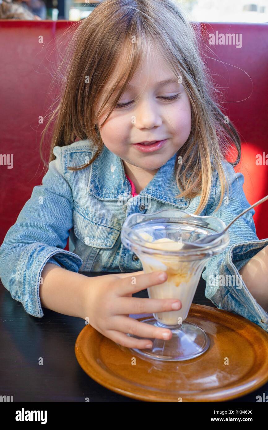 Portrait of five years old blonde little child with blue denim jacket