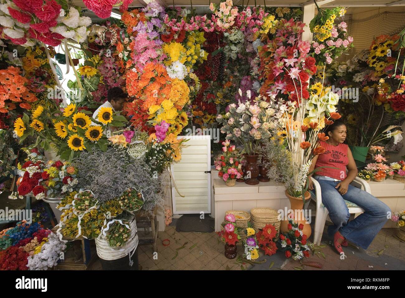 Stalls selling artificial flowers near Daniel Lemaitre street. Cartagena de Indias, Colombia. Stock Photo